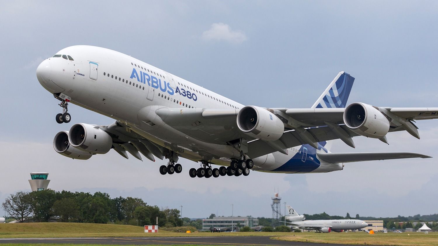 An Airbus A380 in house livery with Rolls-Royce Trent 900 engines taking off.
