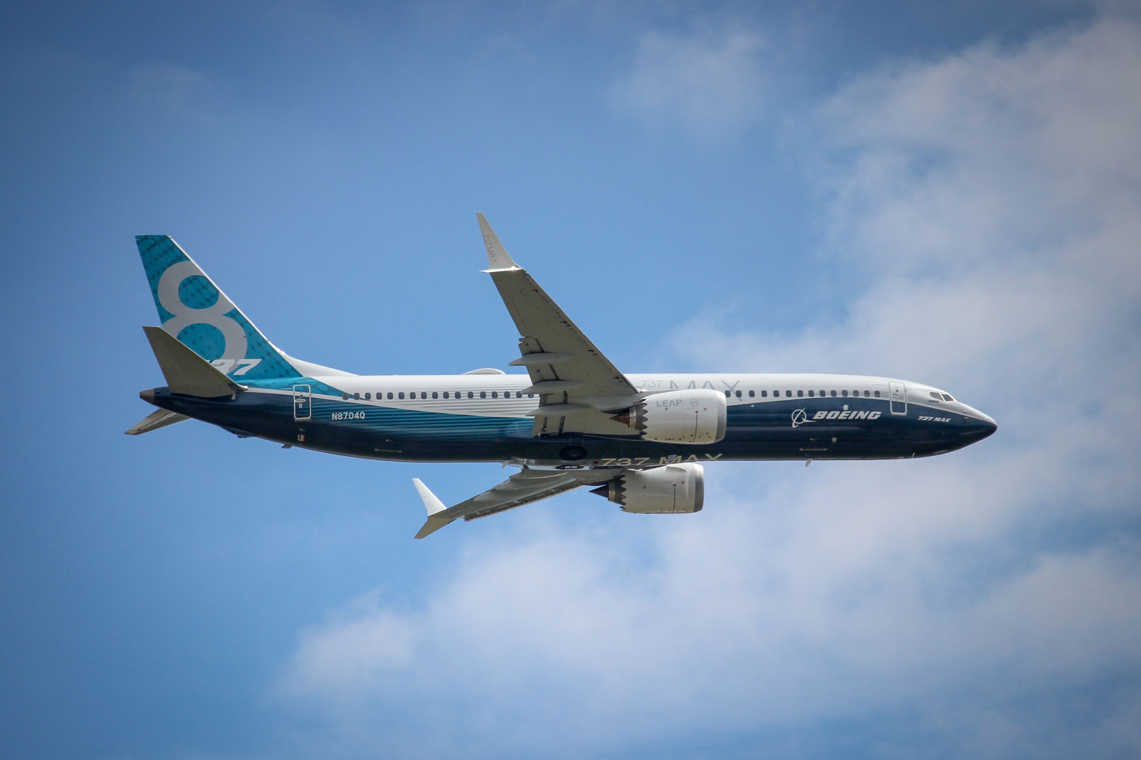 Boeing 737 MAX 8 in its manufacturer livery flying shutterstock_2082487012