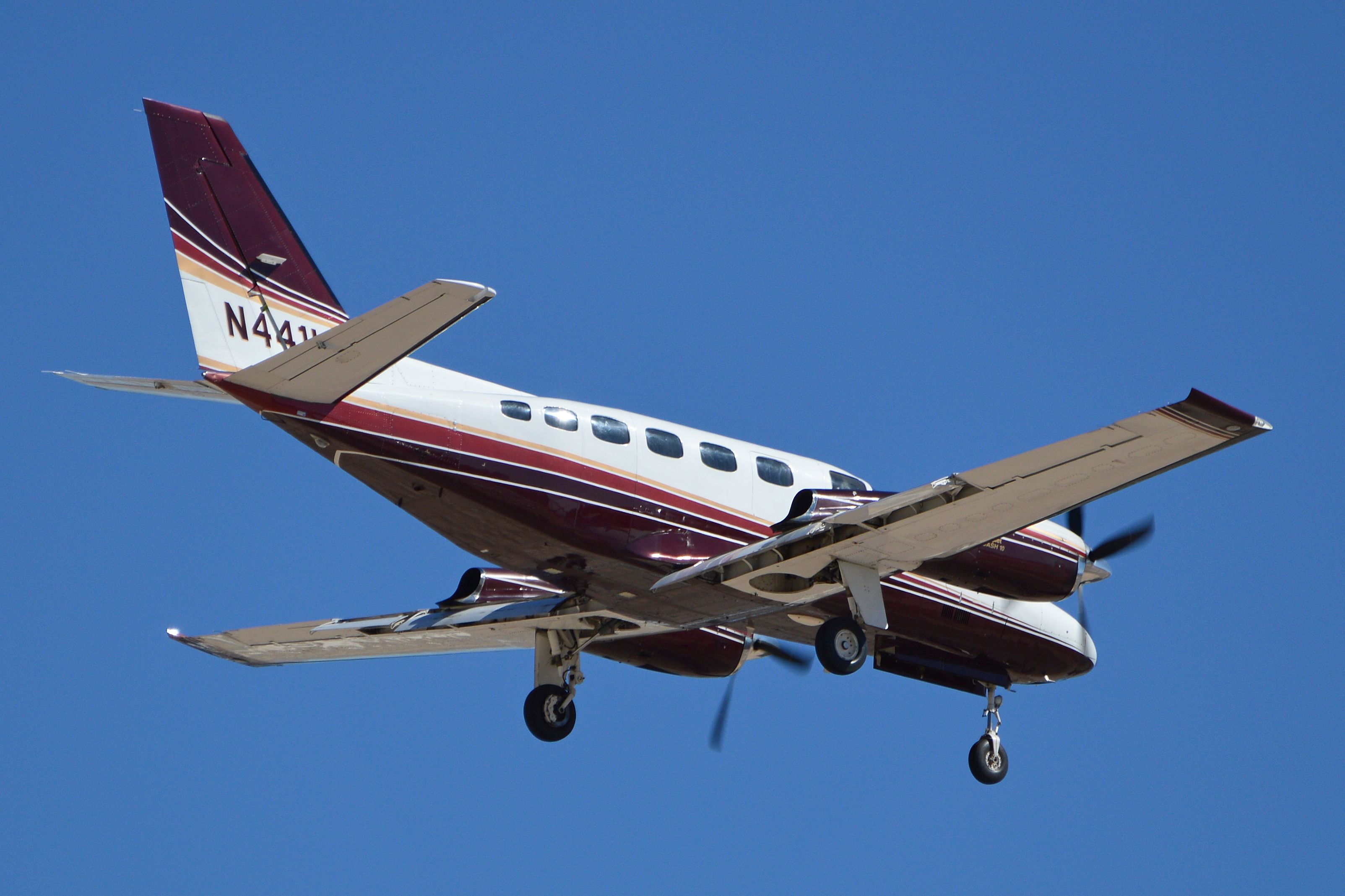 A Cessna 441 Conquest II flying in the sky.
