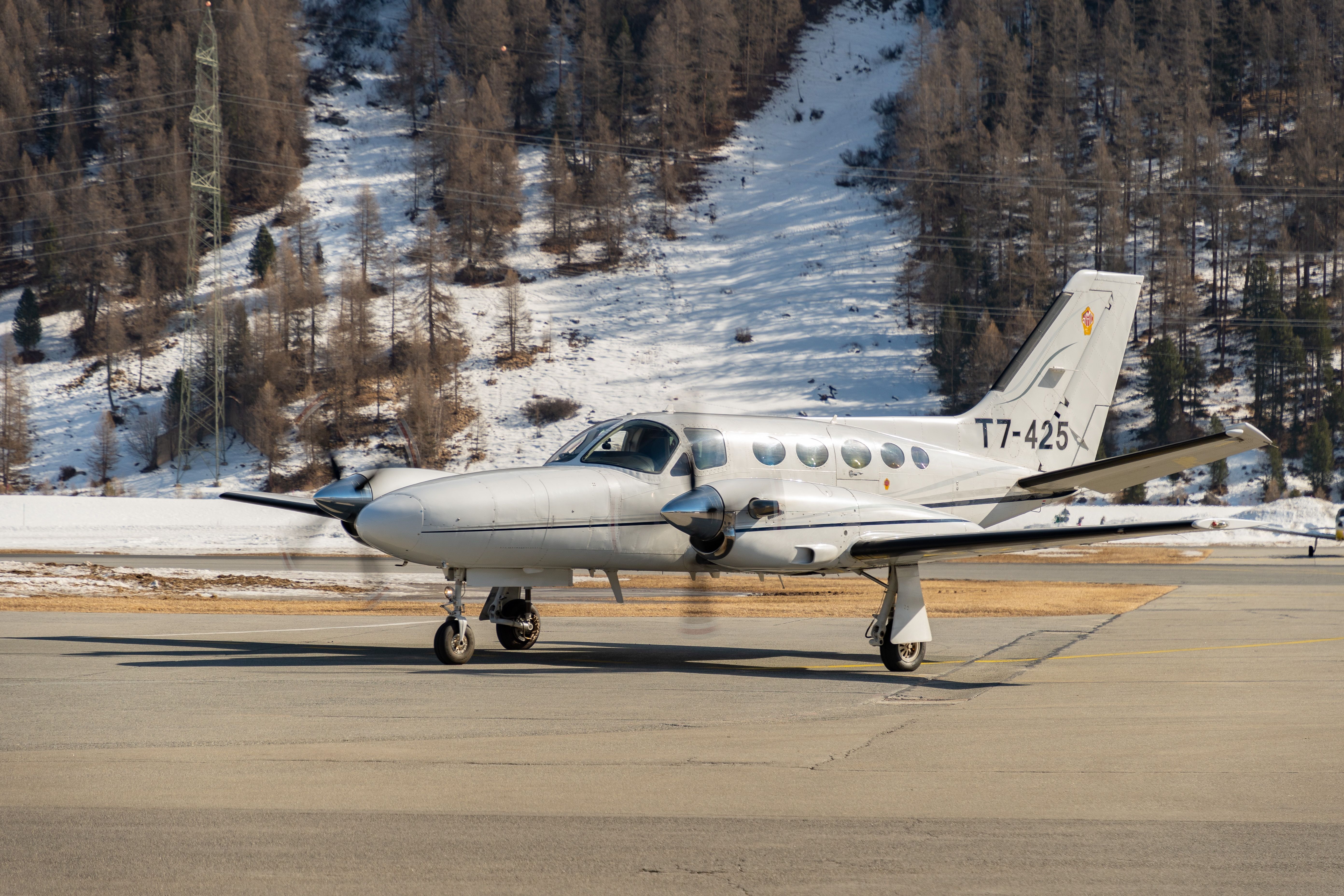 A Cessna 441 Conquest II on an airport apron in Switzerland.