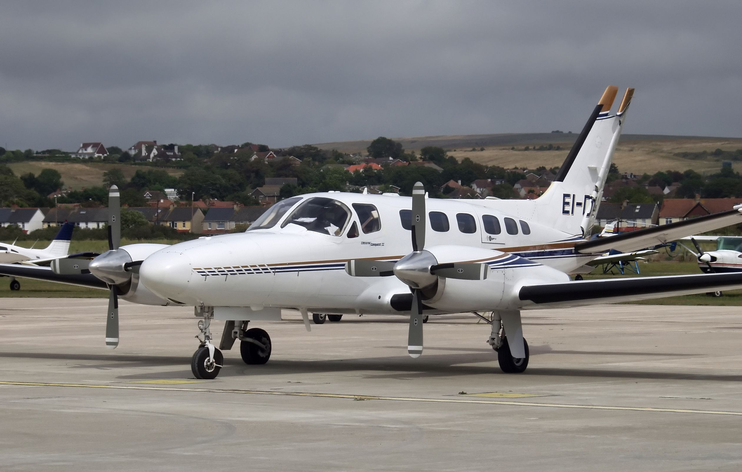 A Cessna 441 Conquest II on an airport apron.