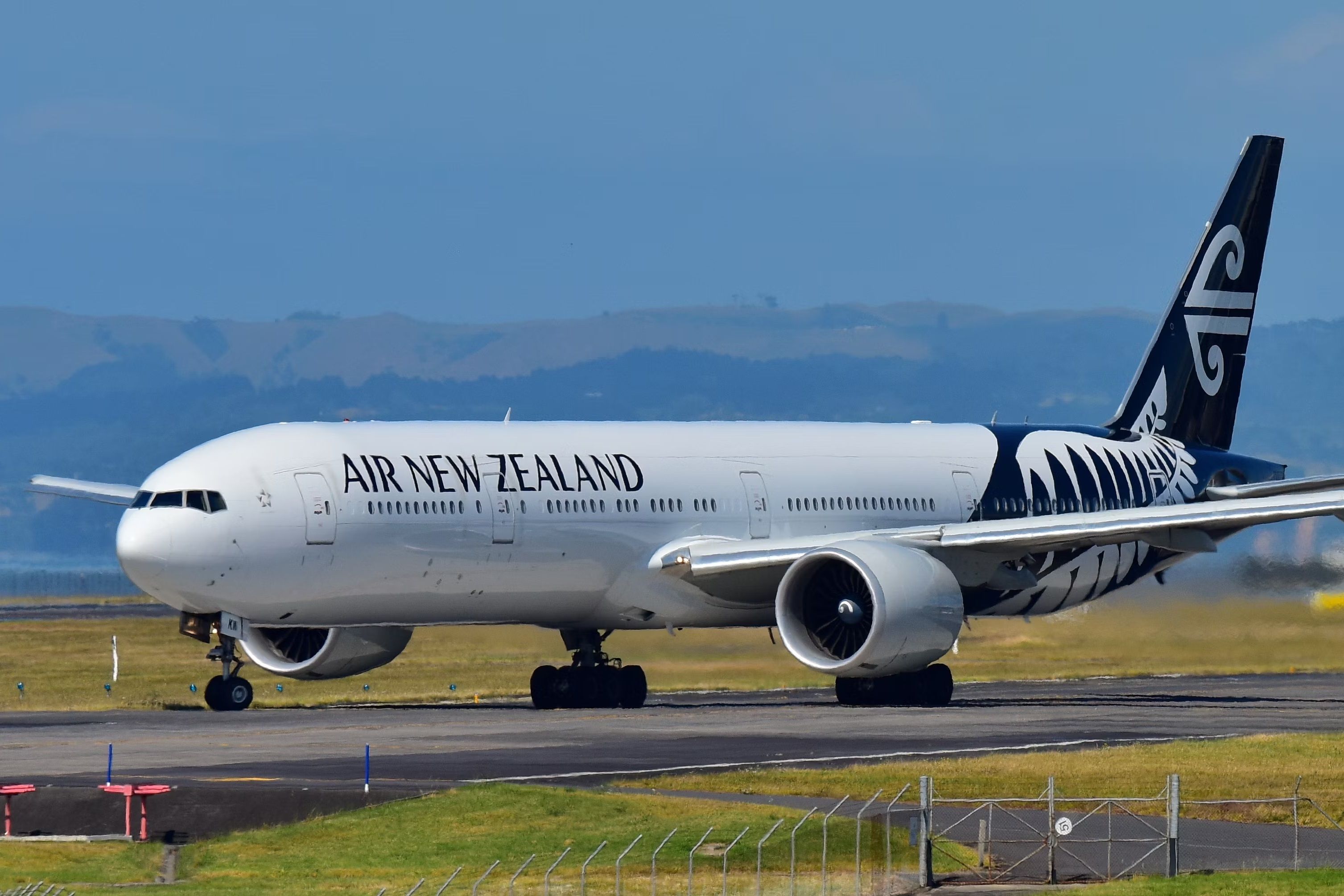 An Air New Zealand Boeing 777-300ER taxiing at Auckland International Airport.