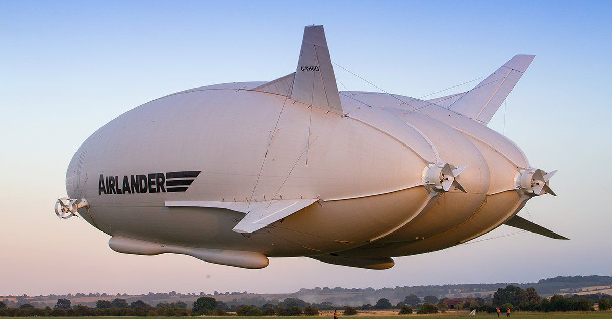 An Airlander 10 airship flying in the sky.