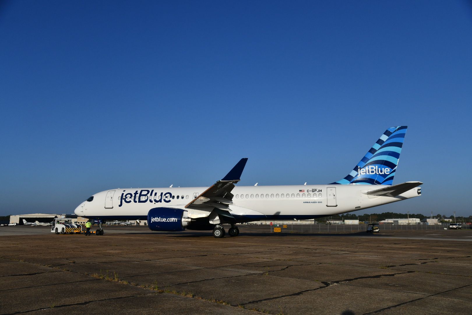 A JetBlue Airbus A220 on the runway