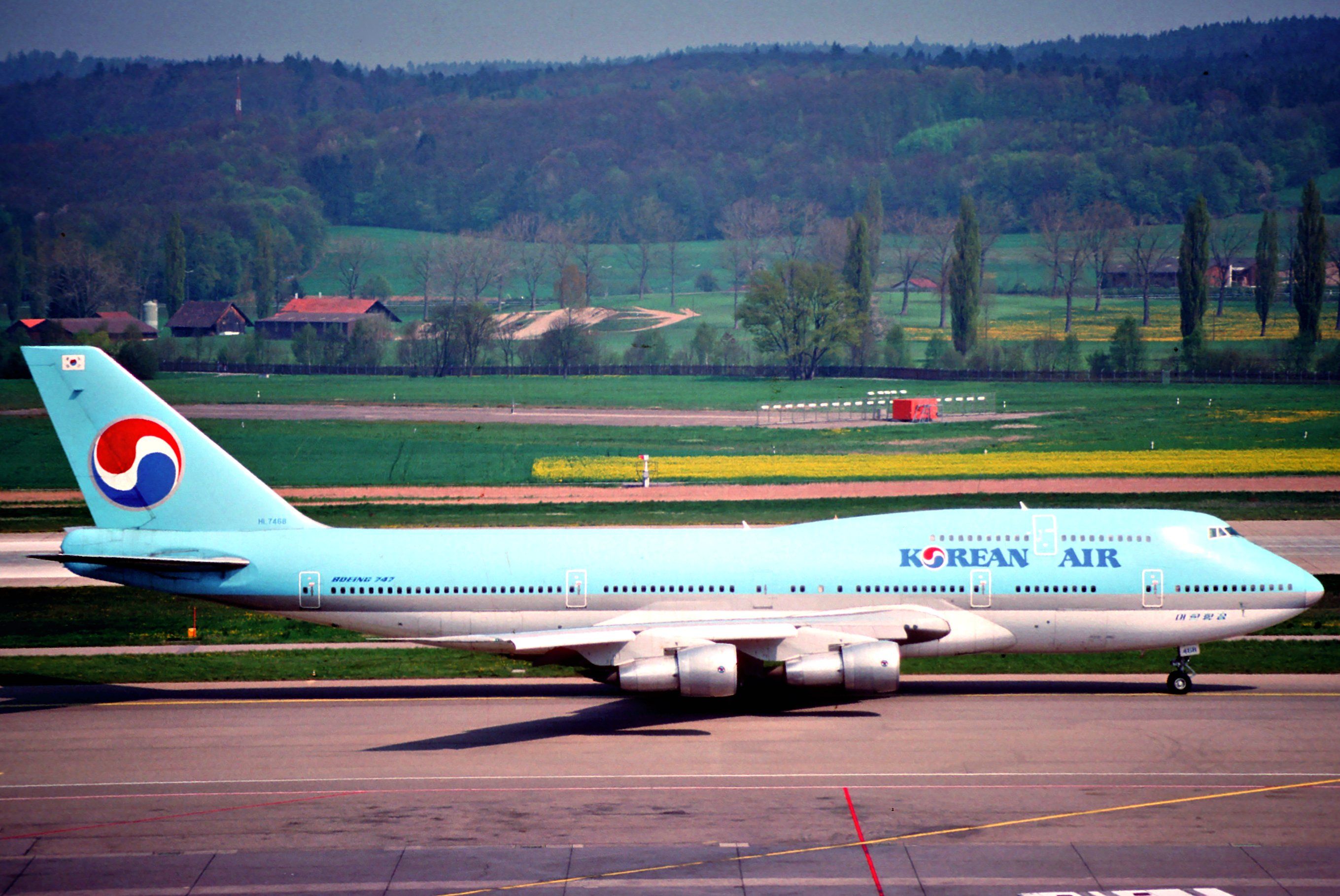 A Korean Air Boeing 747-300 on an airport apron.