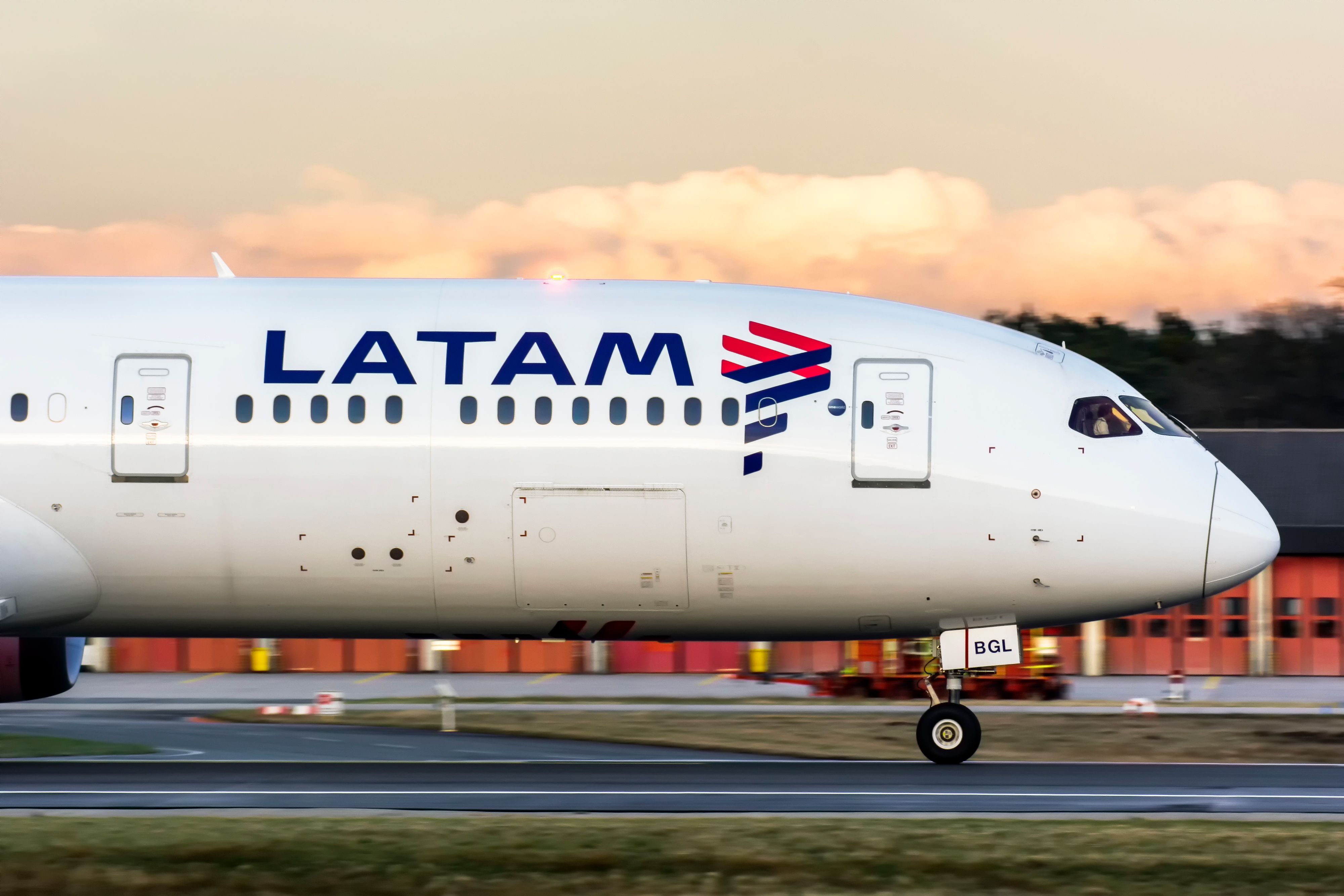 A LATAM Airlines Boeing 787-9 on an airport apron.