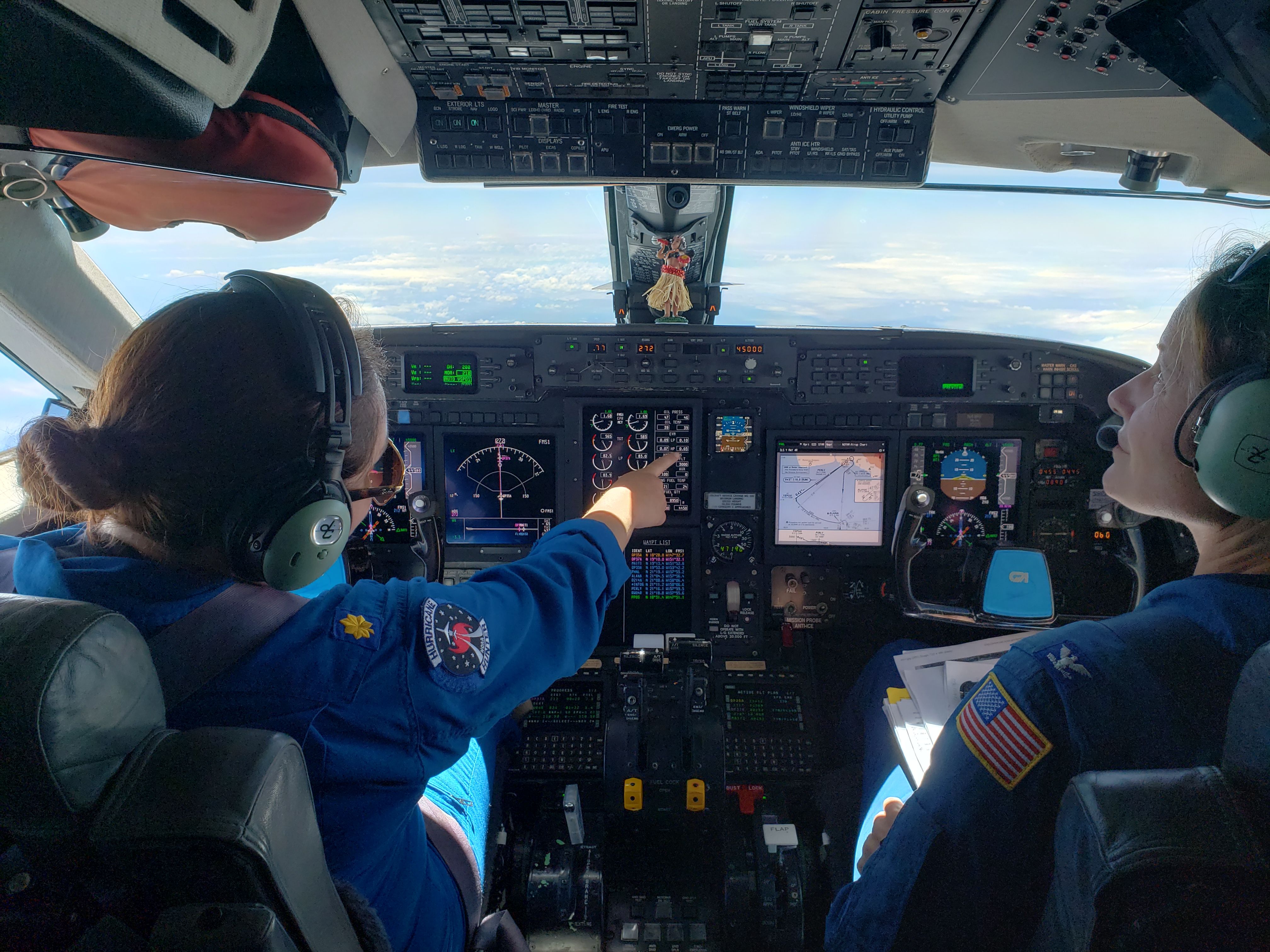 LCDR Rebecca Waddington and CAPT Kristie Twining aboard NOAA's Gulfstream IV-SP during a hurricane surveillance flight on 5 August 2018_Photo by Paul Flaherty NOAA