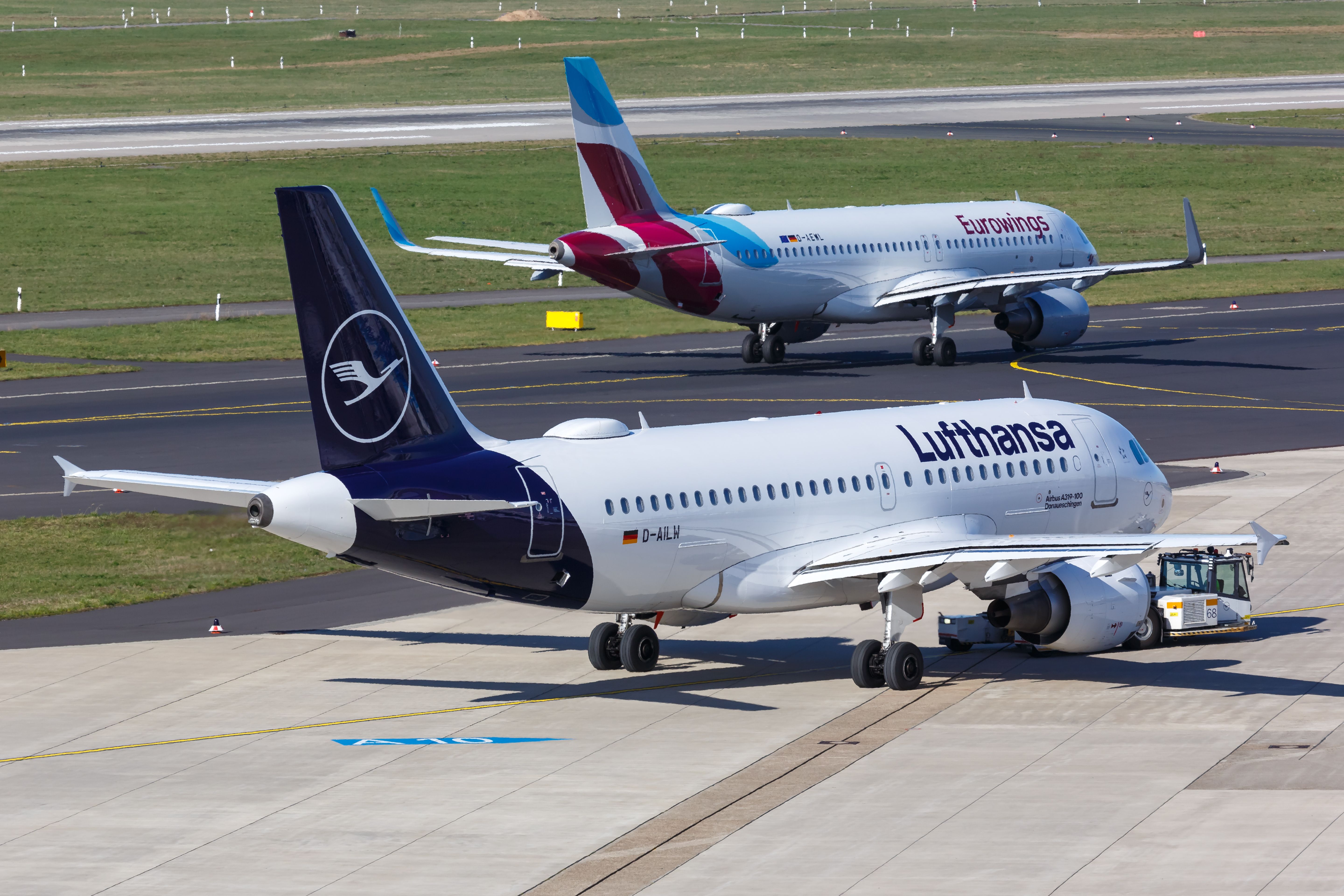 Lufthansa and Eurowings aircraft at Dusseldorf Airport DUS shutterstock_1487054102