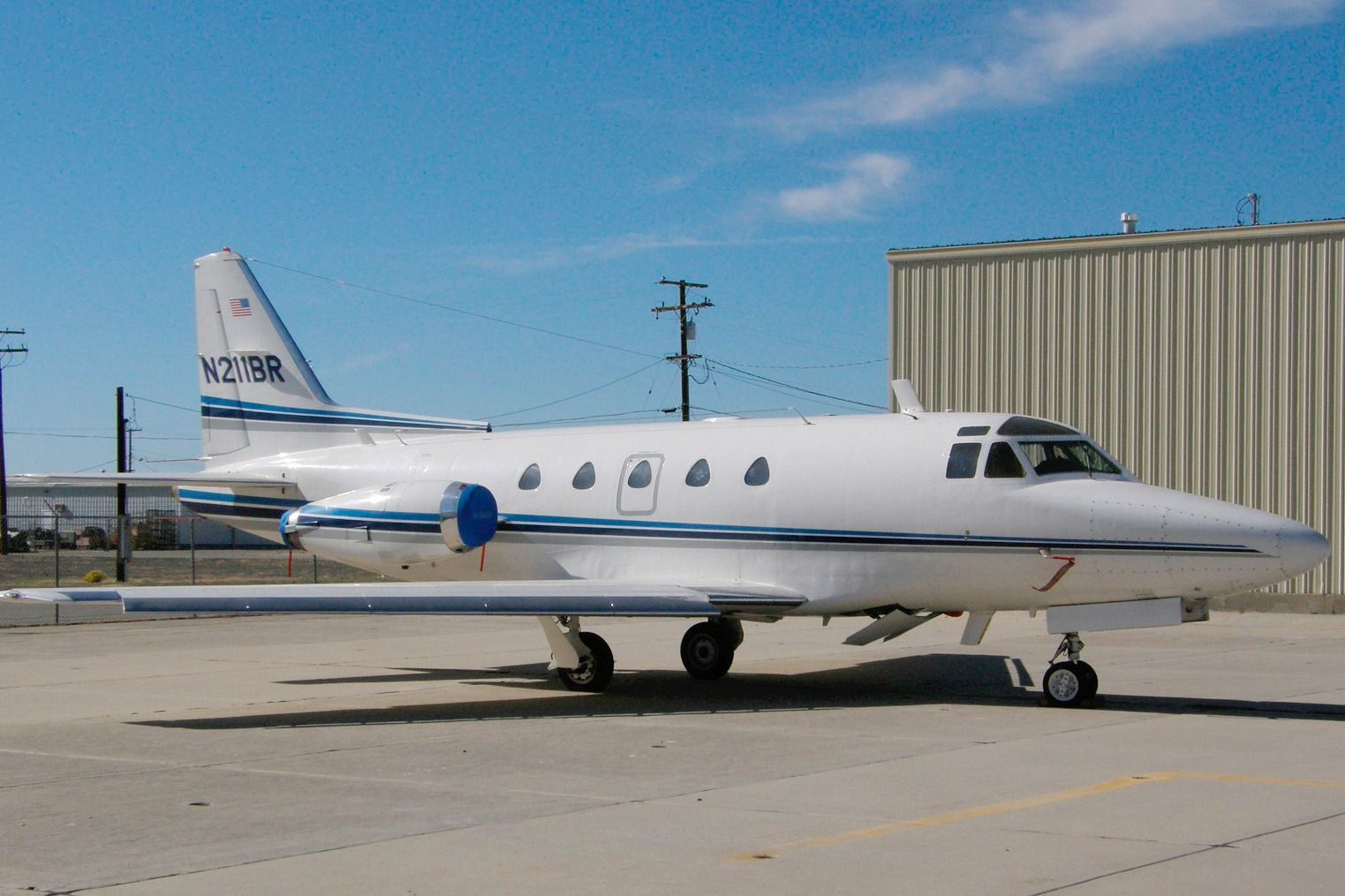 A North American Sabreliner parked on an airfield.