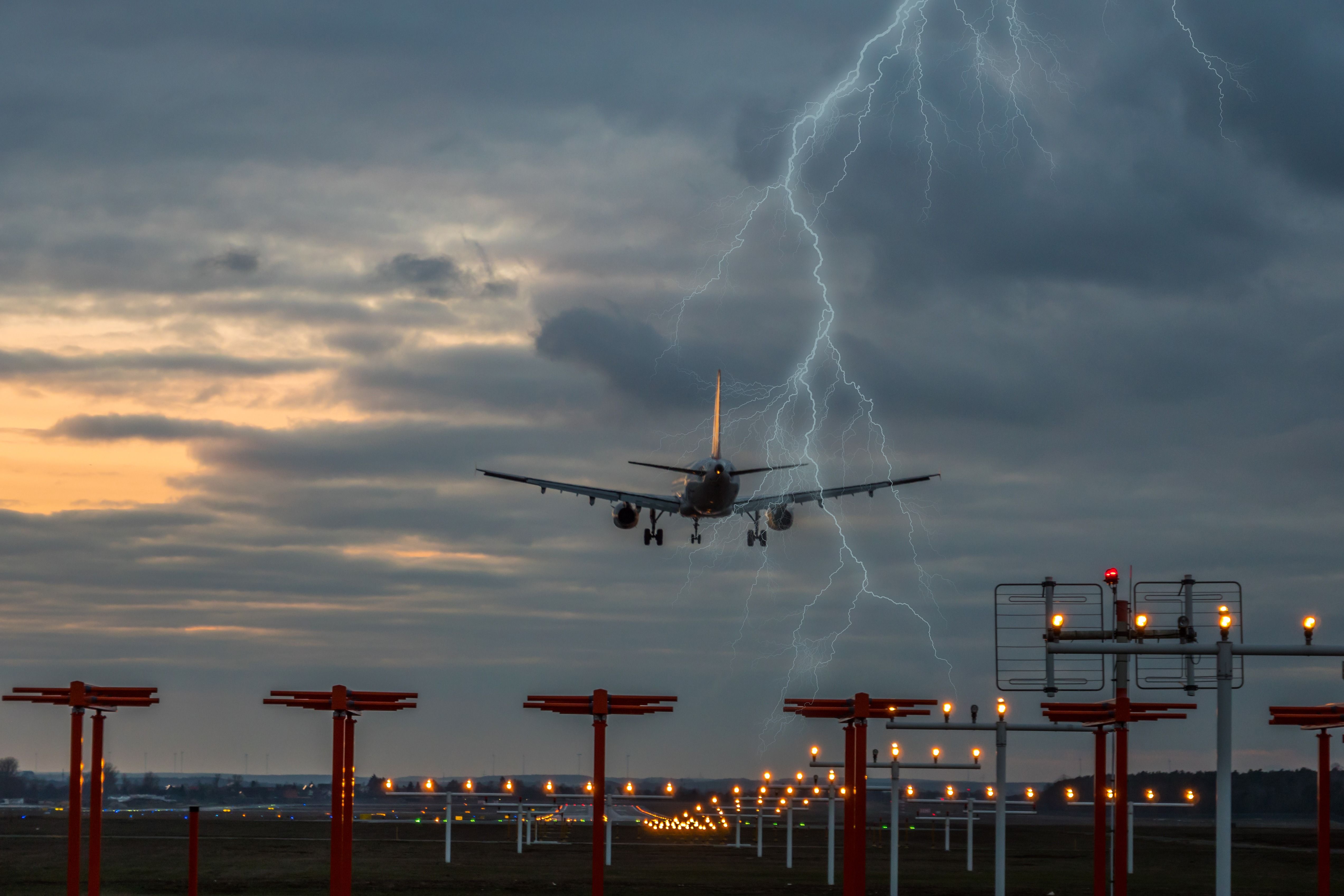 An Aircraft landing during a thundersorm.