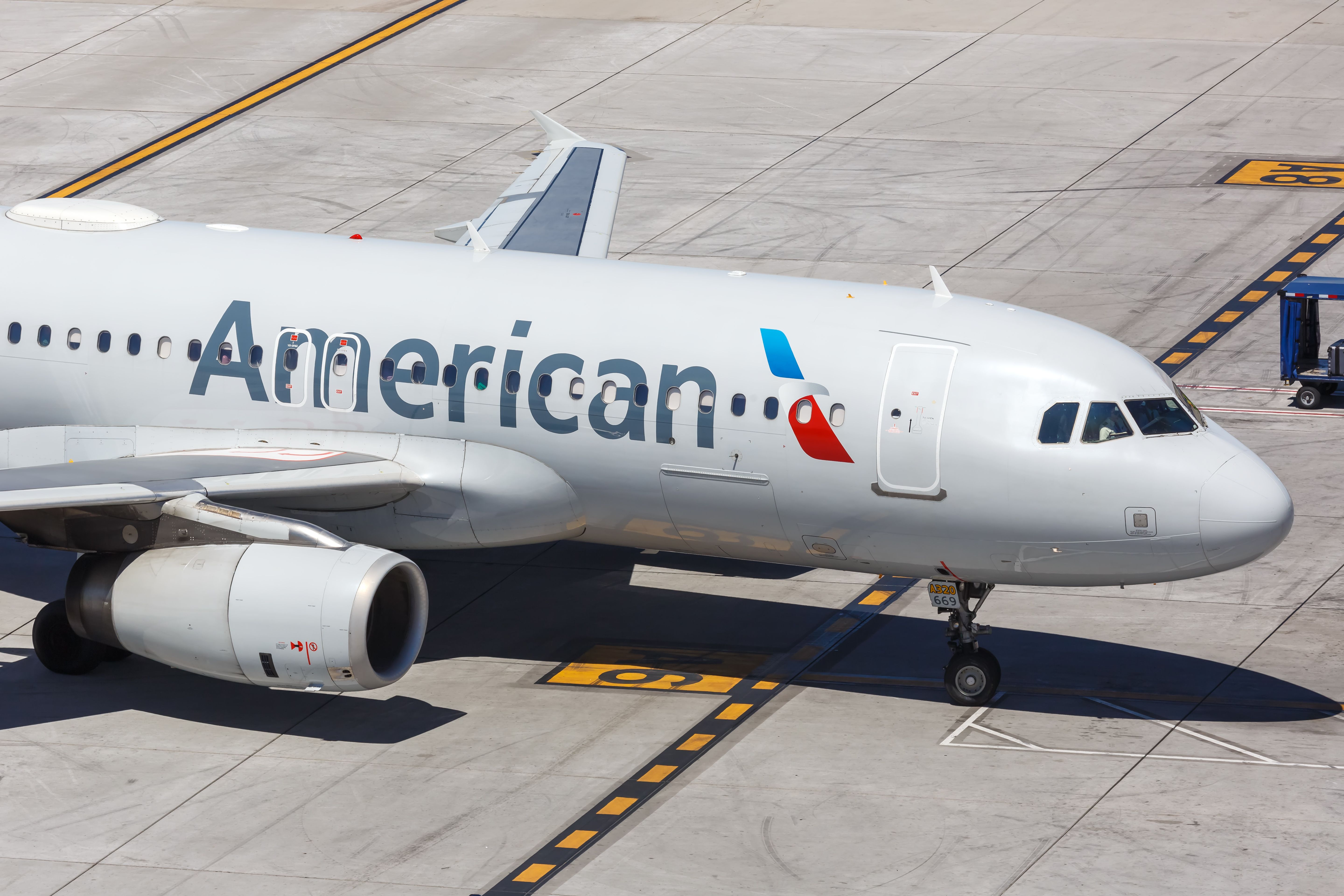 An American Airlines Airbus A320 on the apron of an airport.