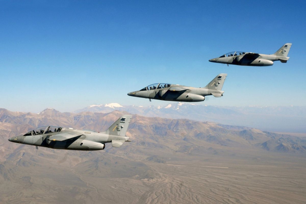 Aircraft of the Argentine Air Force flying over a desert area.