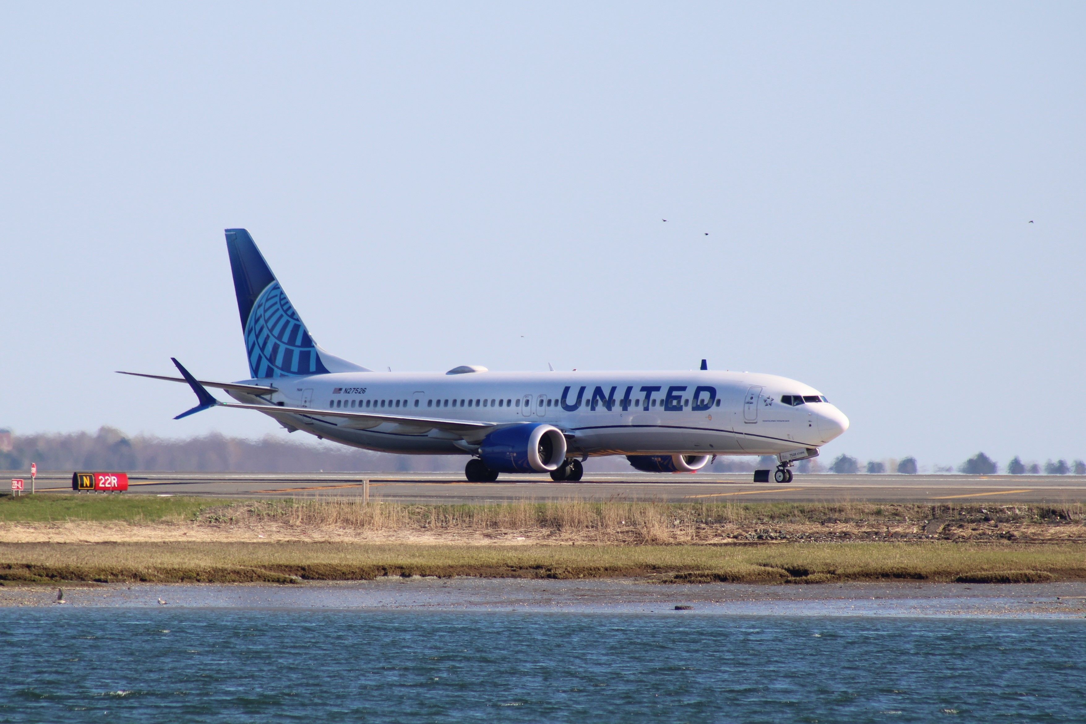 A United Airlines Boeing 737 MAX 9 on an airport apron.
