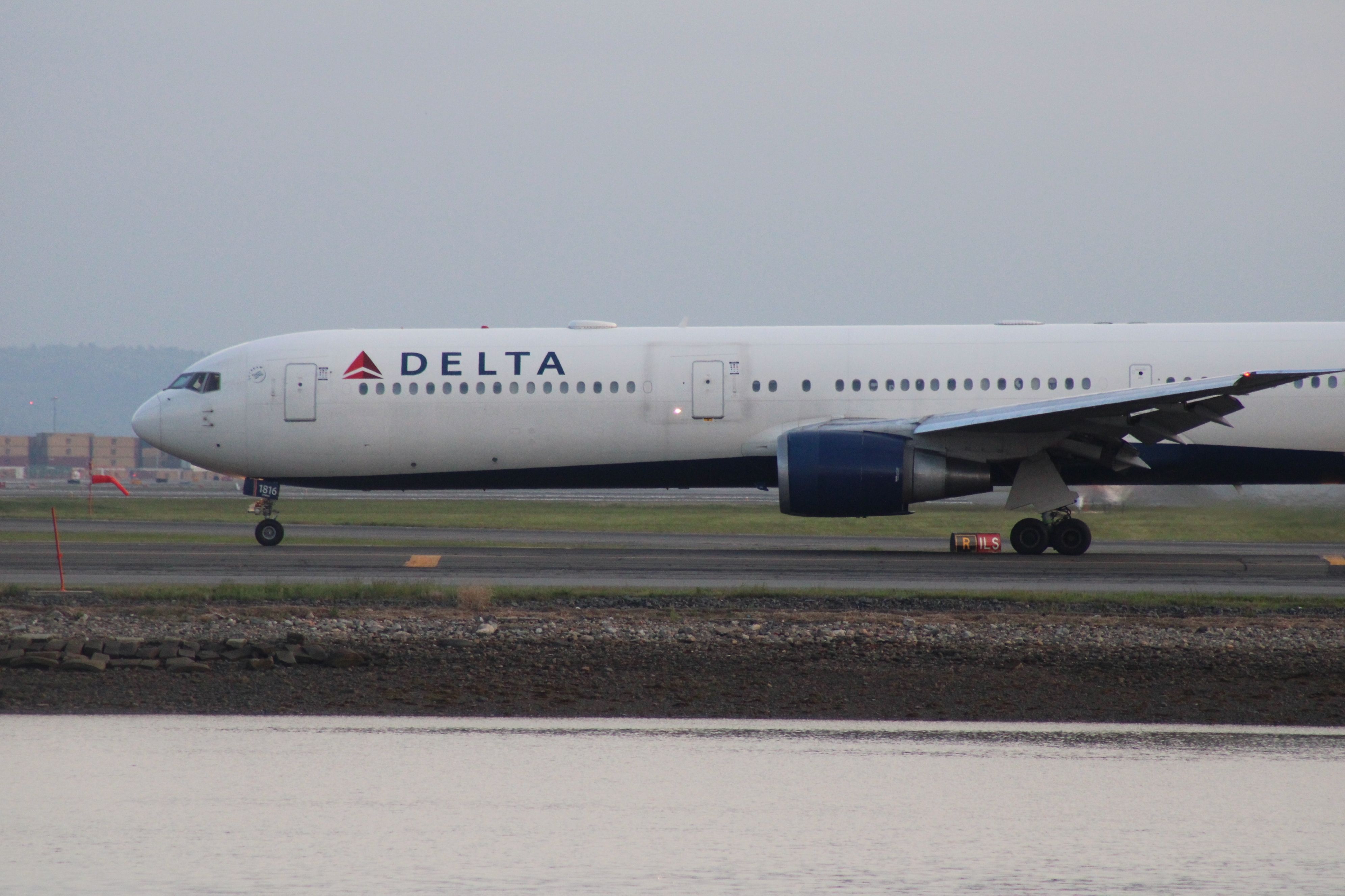 A Delta Air Lines Boeing 767-400ER on an airport apron.