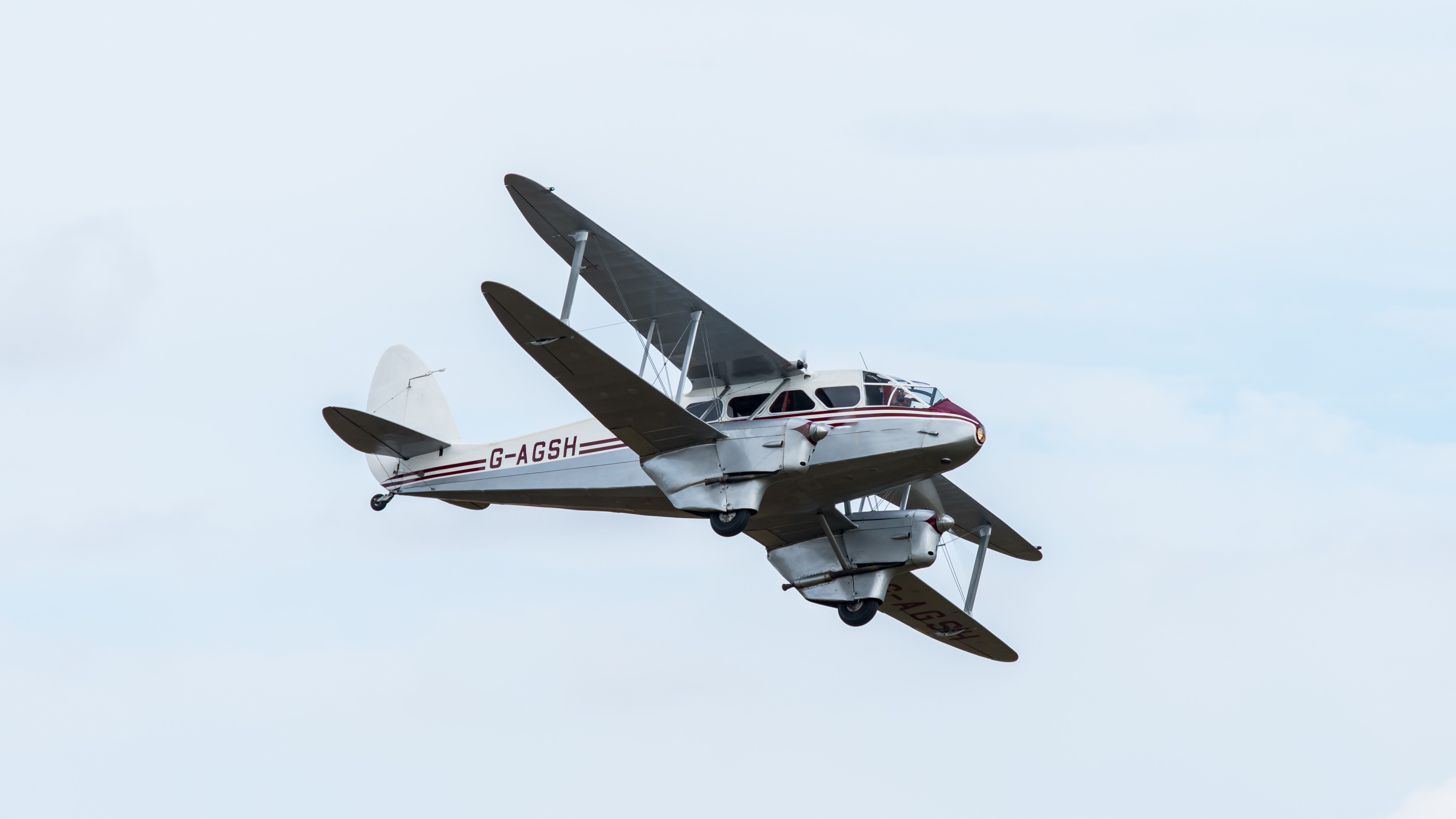 A De Havilland Dragon Rapide Flying in the sky.