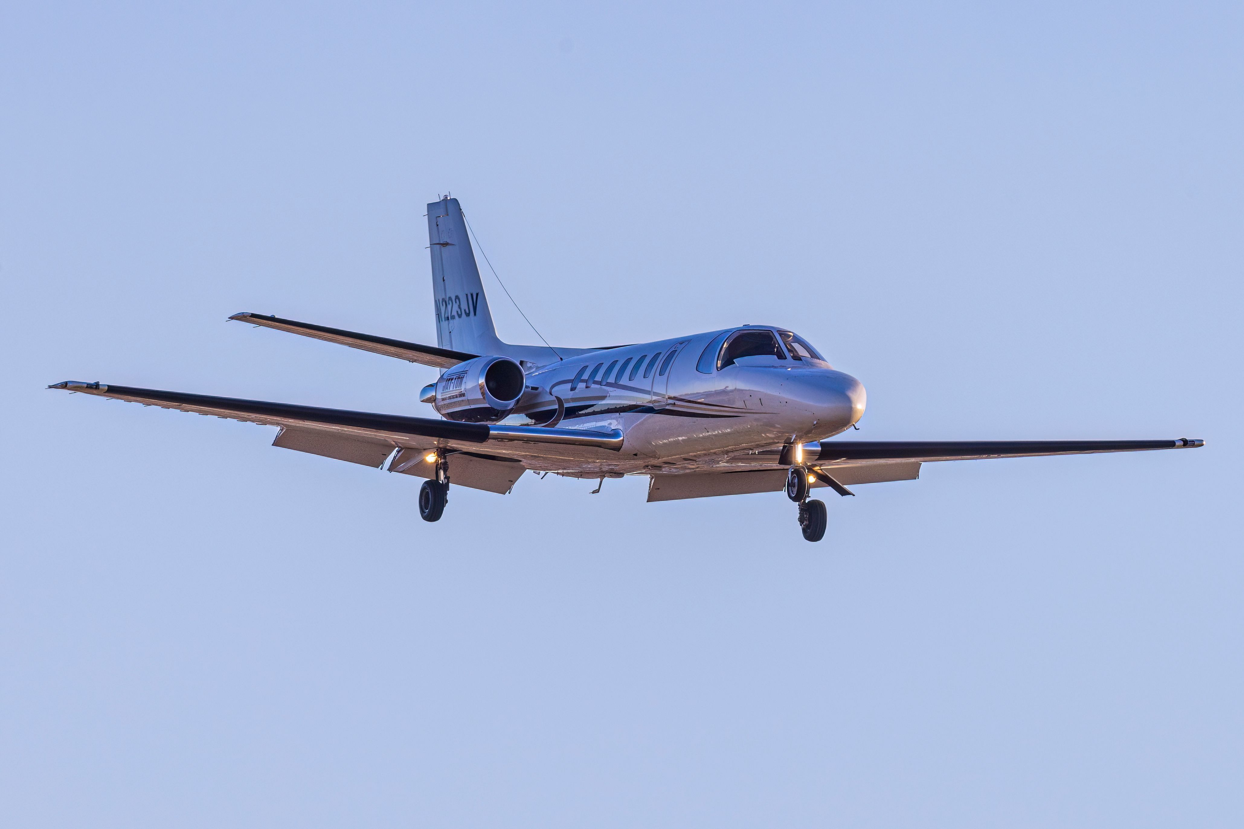 A Cessna Citation V flying in the sky.