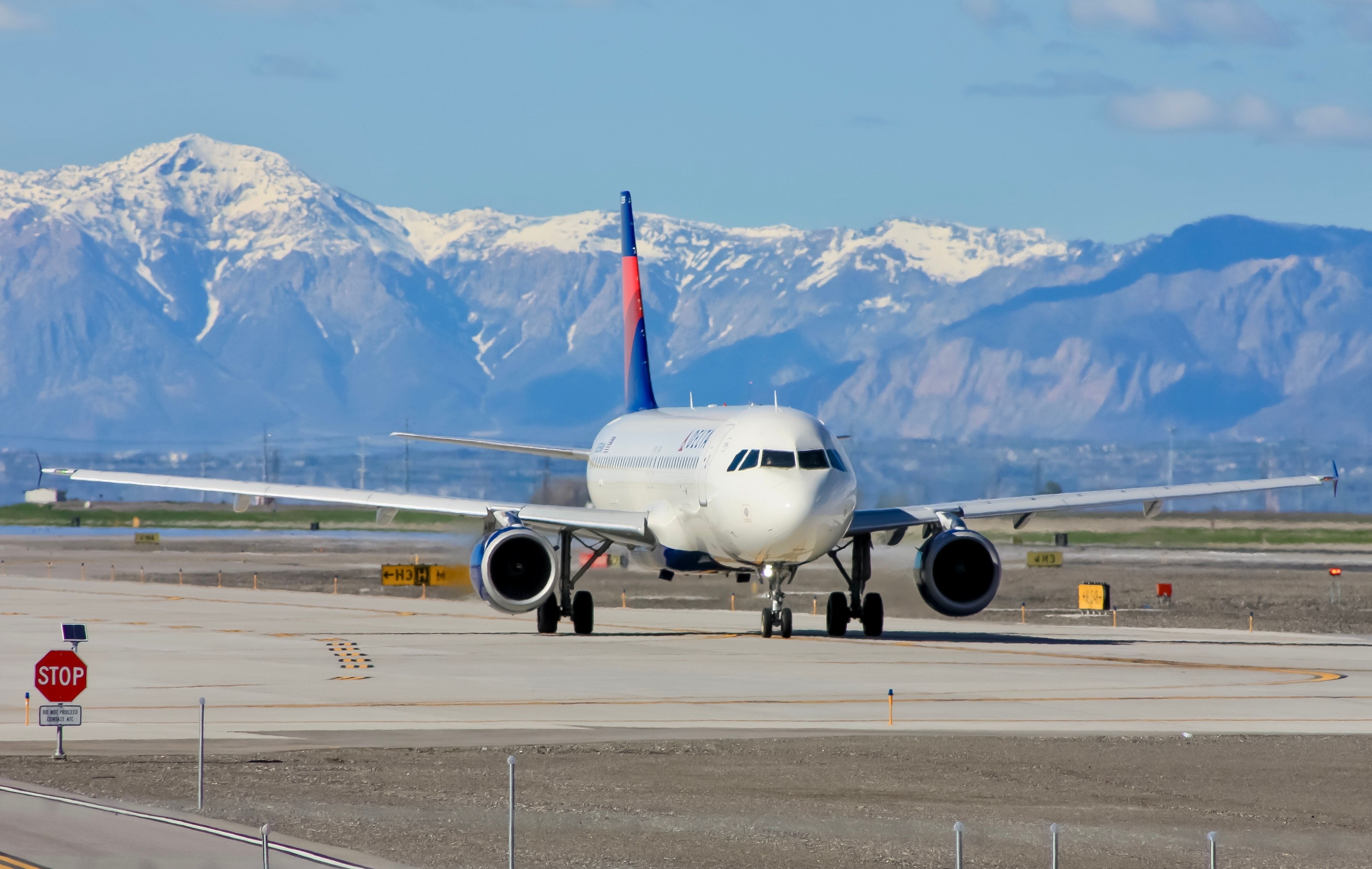 A Delta Air Lines Airbus A320 on an airport apron.