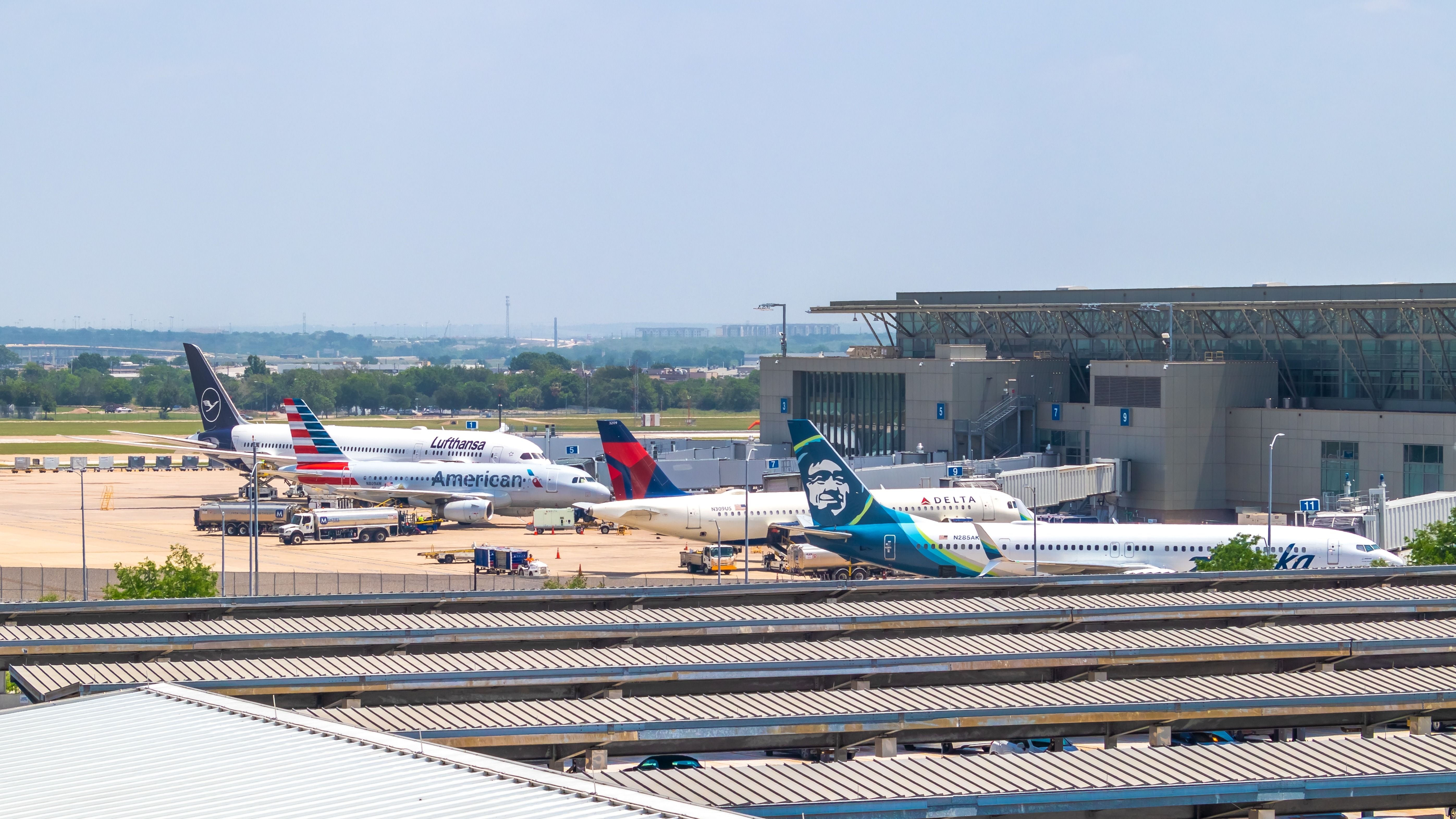 Several commercial aircraft at their gates at Austin-Bergstrom International Airport.