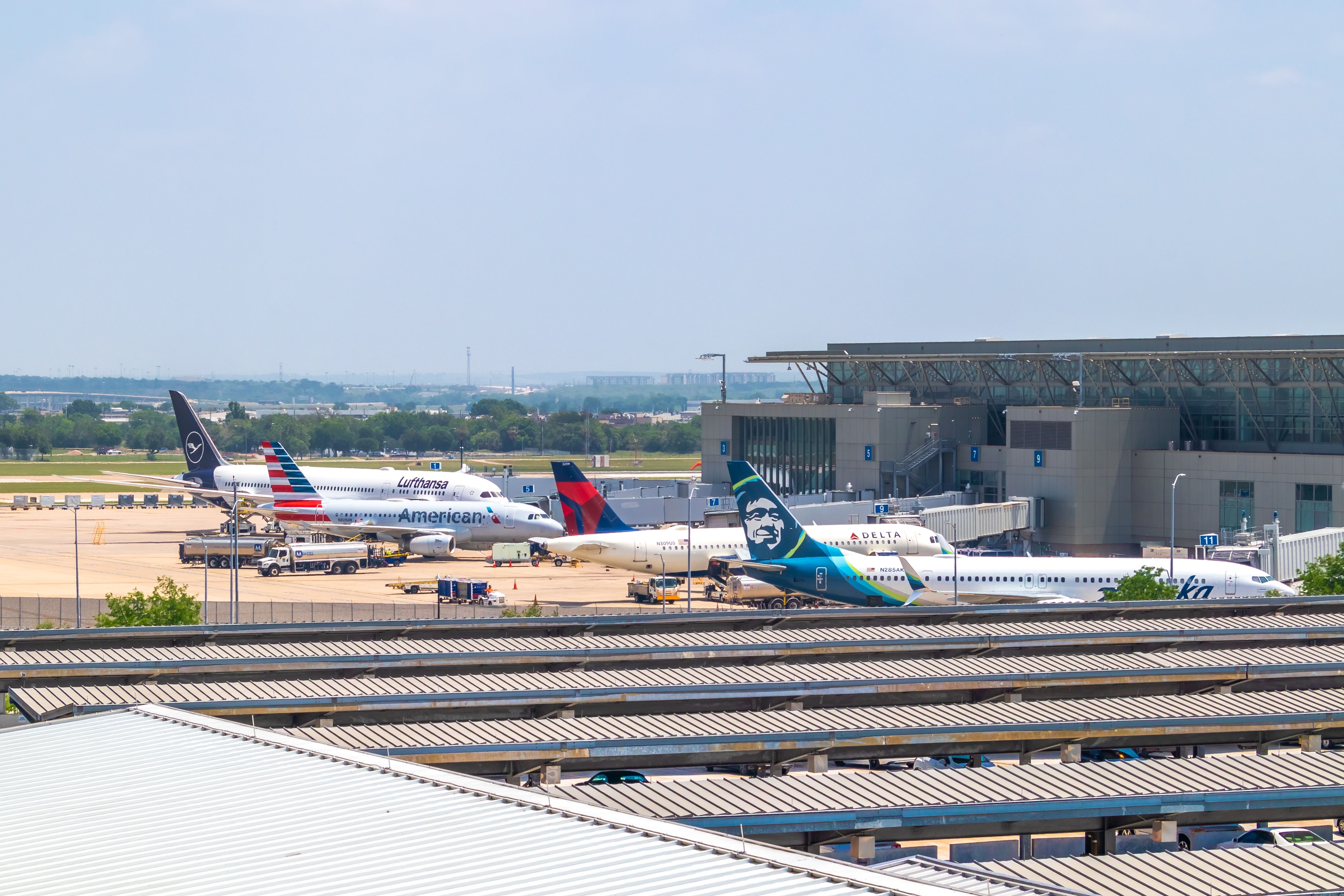Several commercial aircraft at their gates at Austin-Bergstrom International Airport.