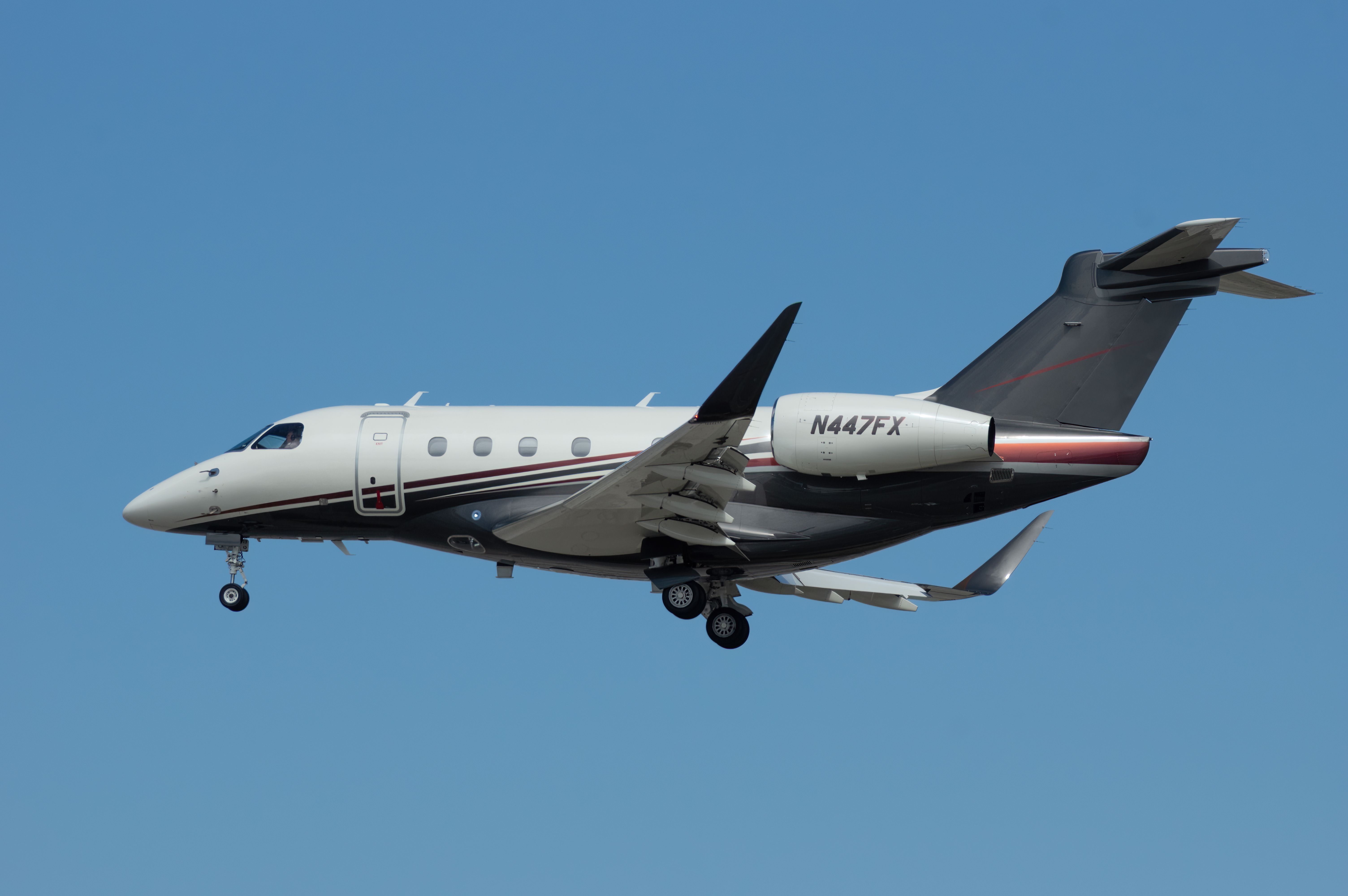 Embraer Praetor 500 jet with registration N447FX shown on final approach into LAX, Los Angeles International Airport