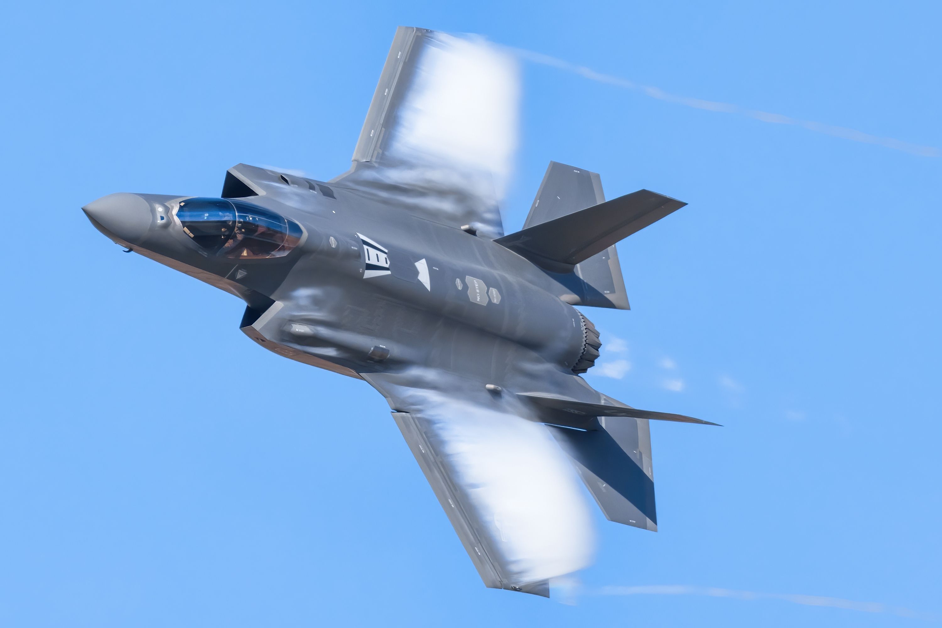 A US Air Force Lockheed Martin F-35A Lightning II flying in the sky.