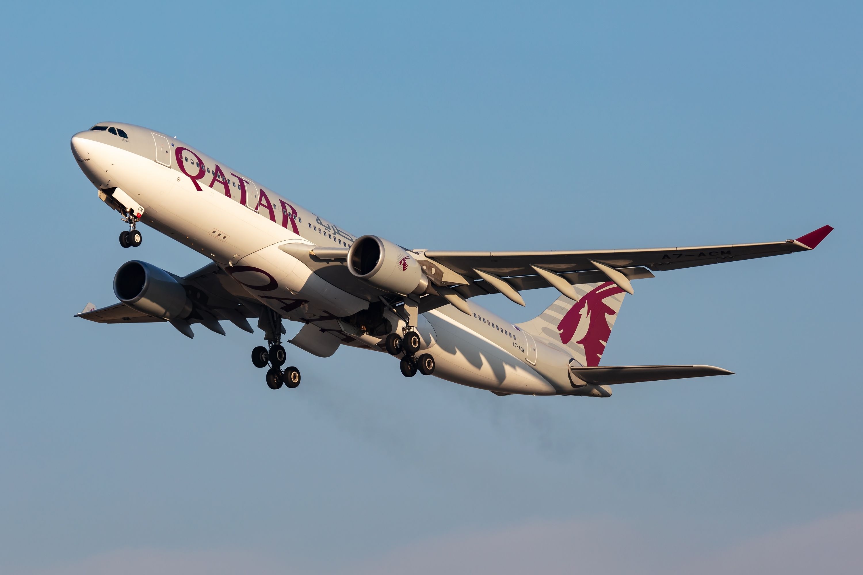 A Qatar Airways Airbus A330-200 flying in the sky.