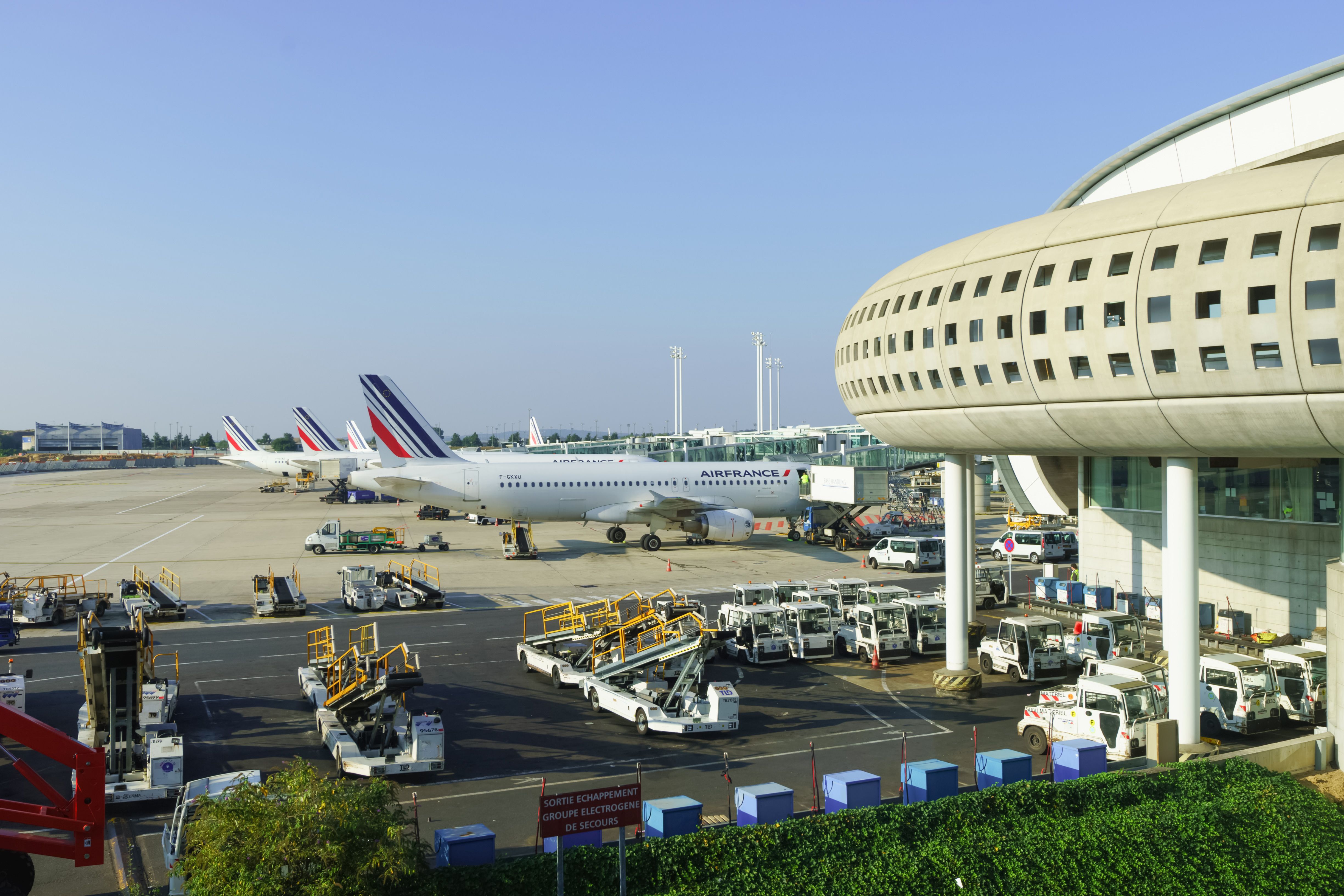 Several Air France aircraft parked on the apron at Paris Charles de Gaulle Airport Terminal 1.