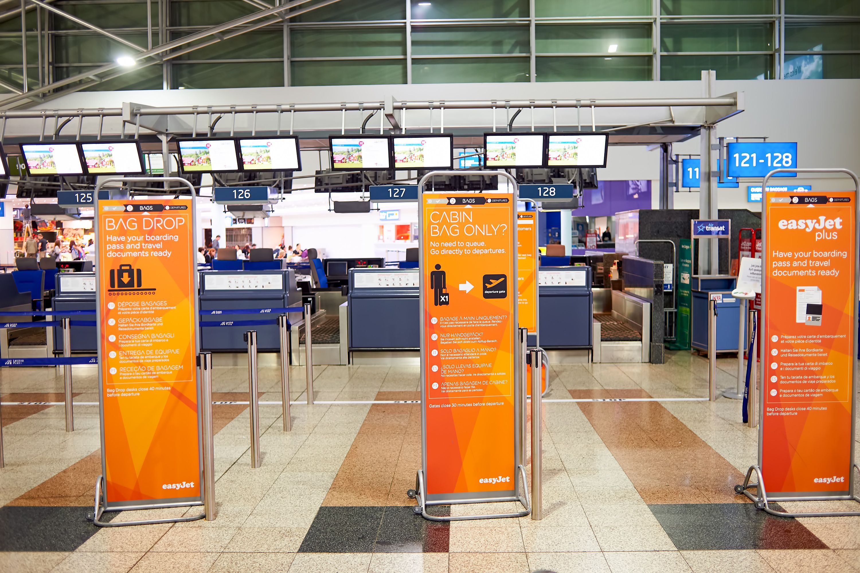 An easyJet check in area of an airport.
