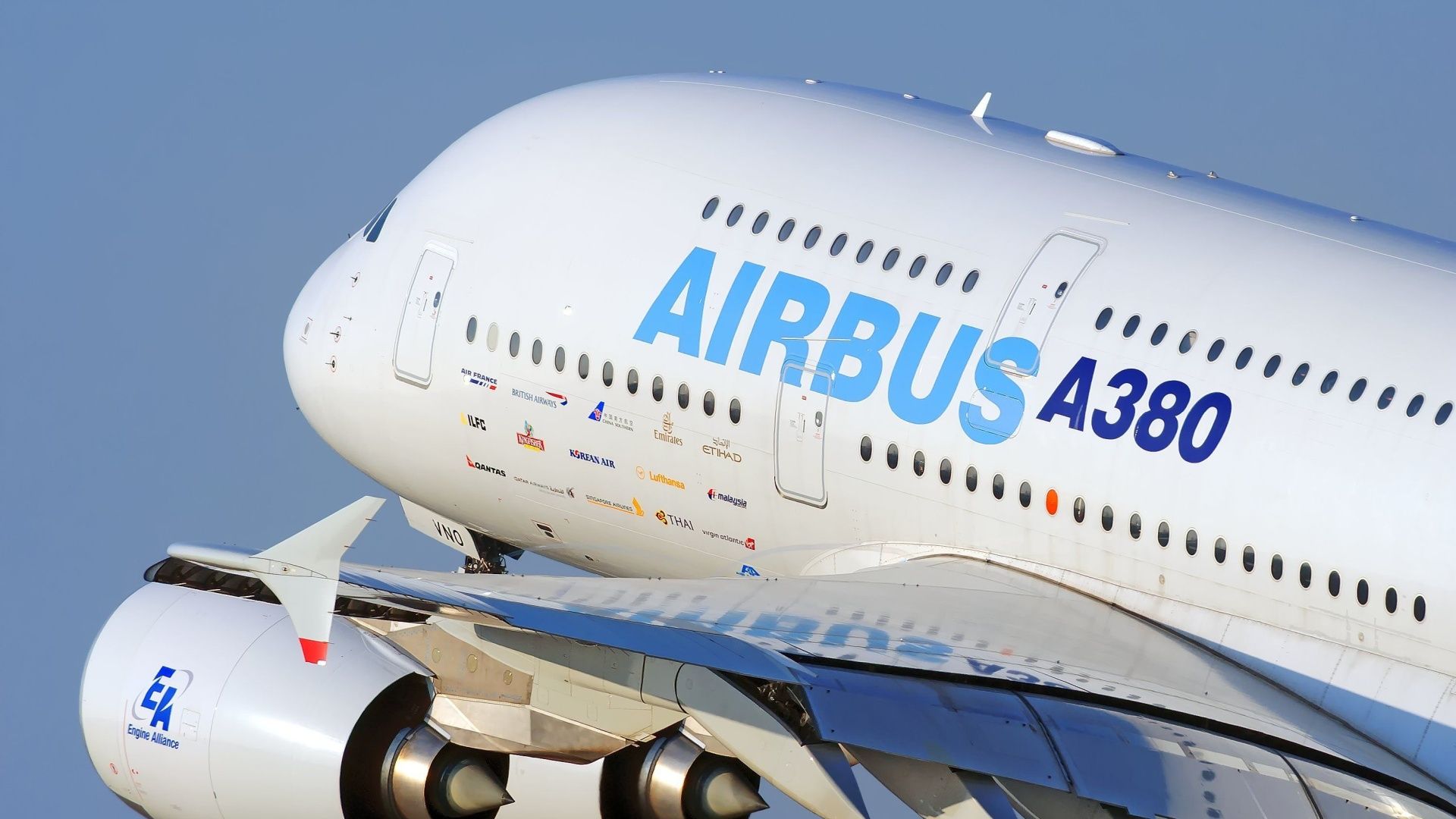 A Closeup of the nose of an Airbus A380 flying in the sky.