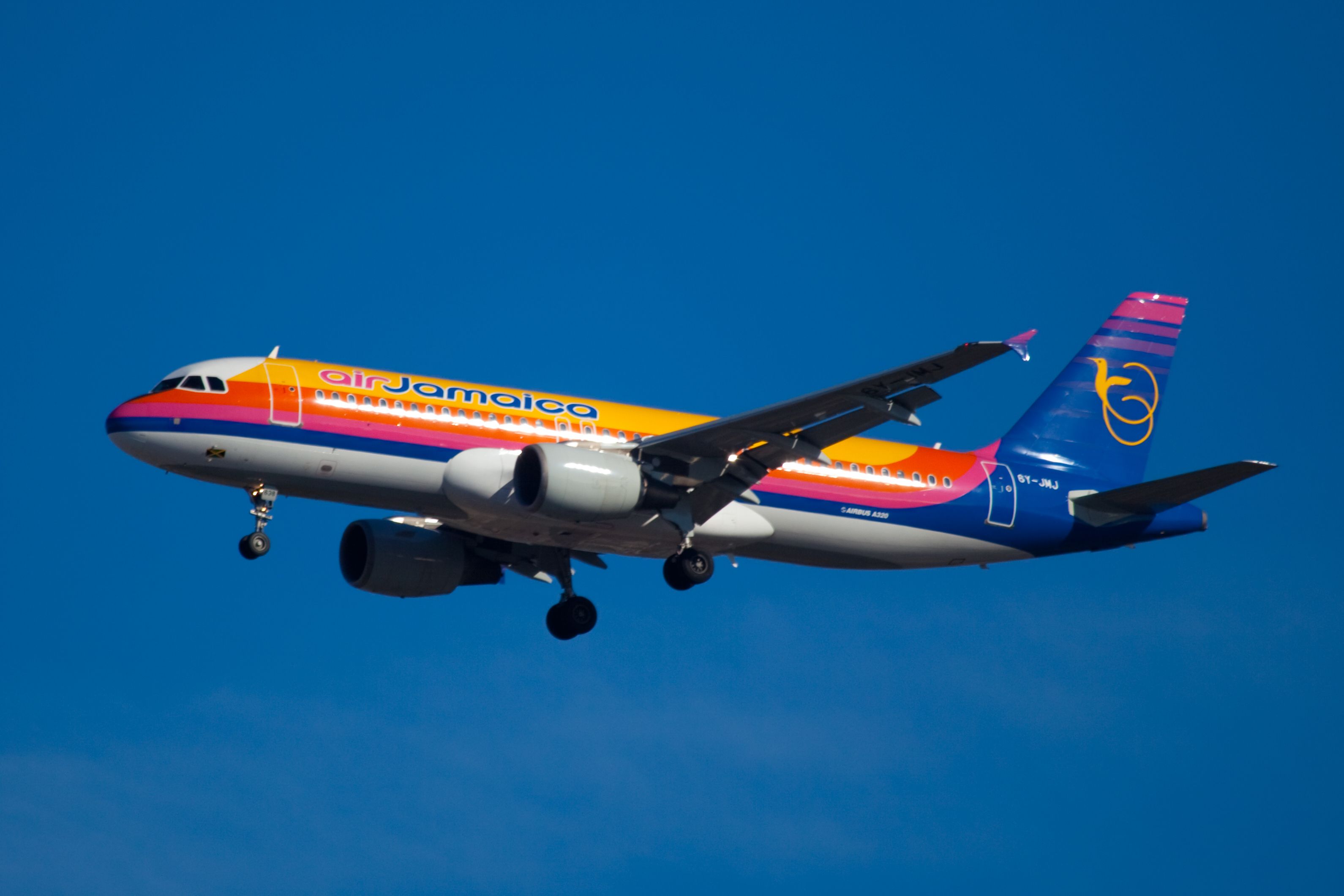 An Air Jamaica Airbus A320 Flying in the sky.