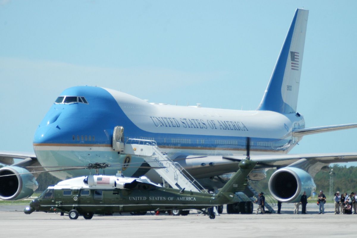The aircraft associated with the names Air Force One and Marine One parked side by side on an airfield apron.
