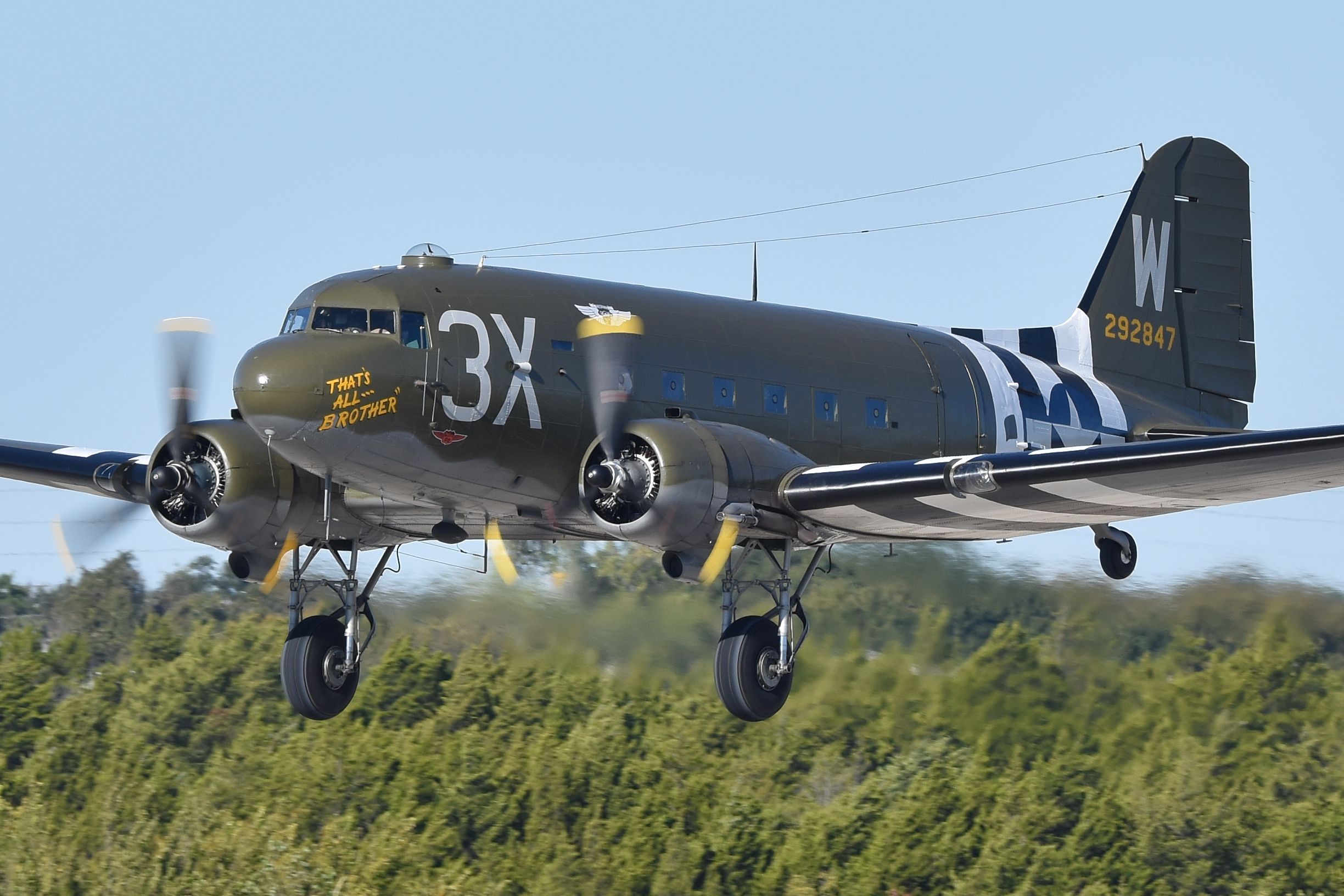 That's All Brother Douglas C-47 Skytrain flying low to the ground.