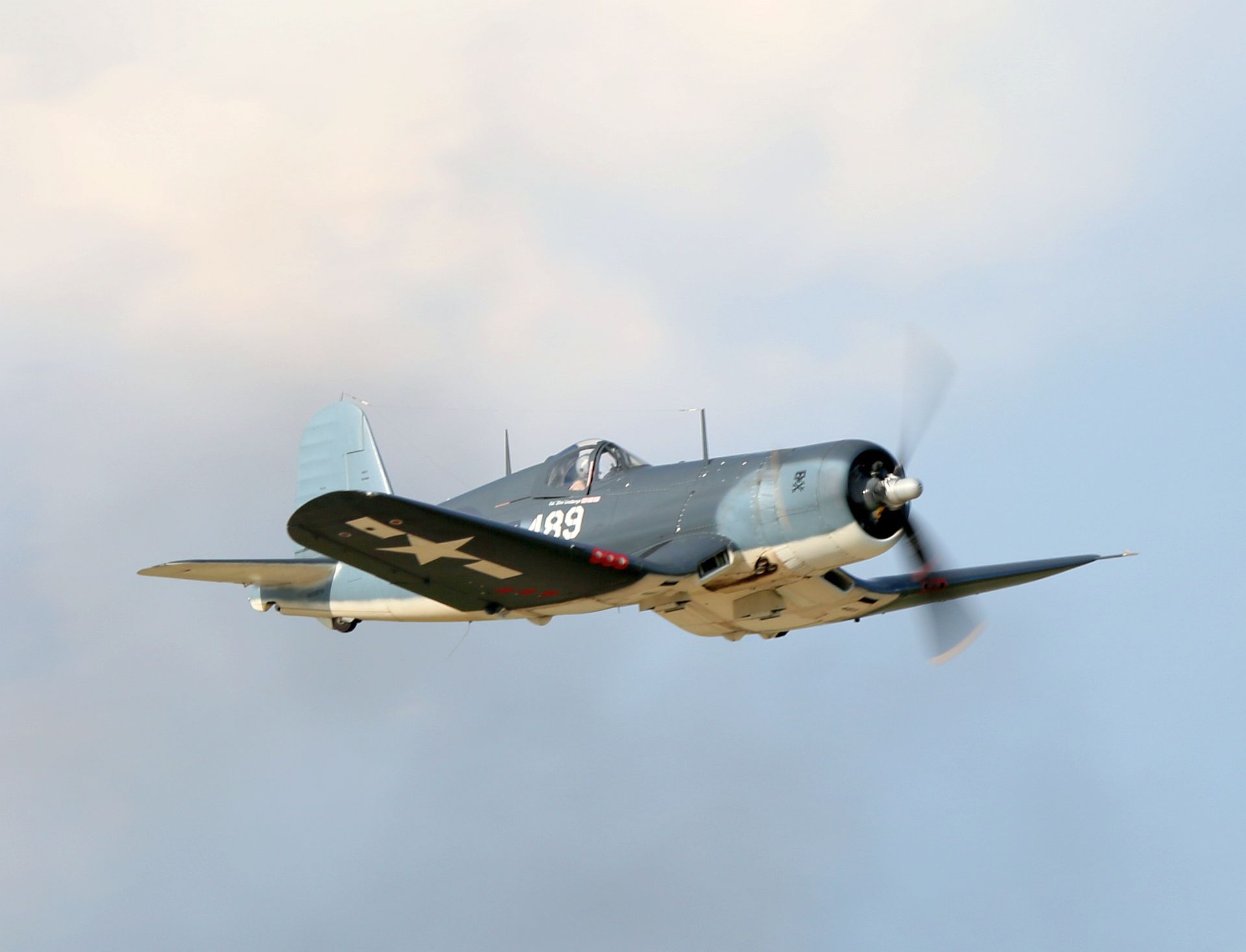 A Vought F4U Corsair flying in the sky.