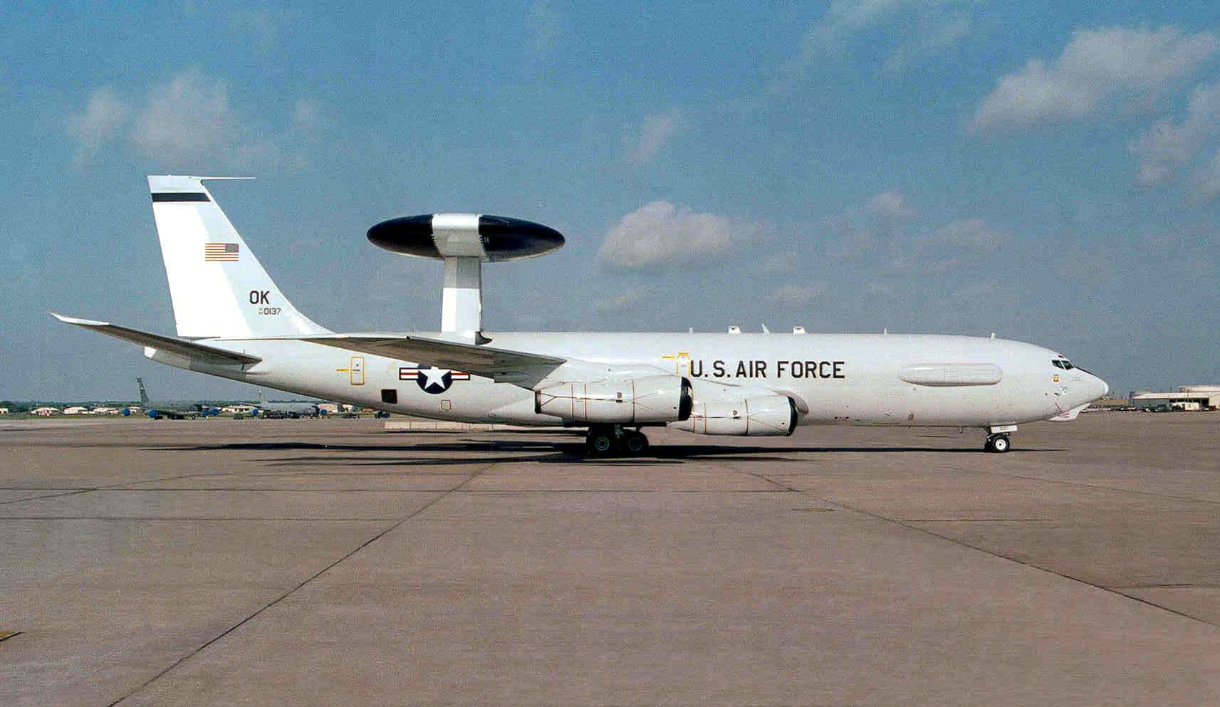A USAF E-3 Sentry parked on an airfield apron.