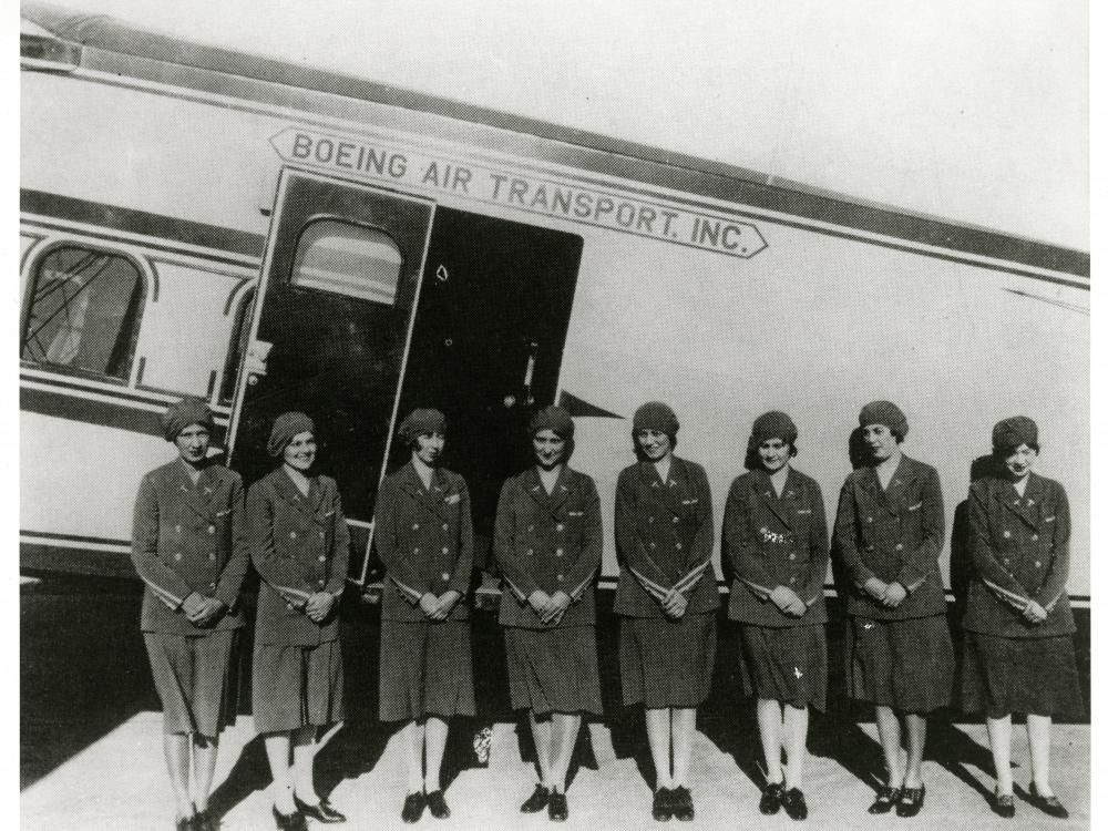 Ellen Church and the Original Eight flight attendants standing together.