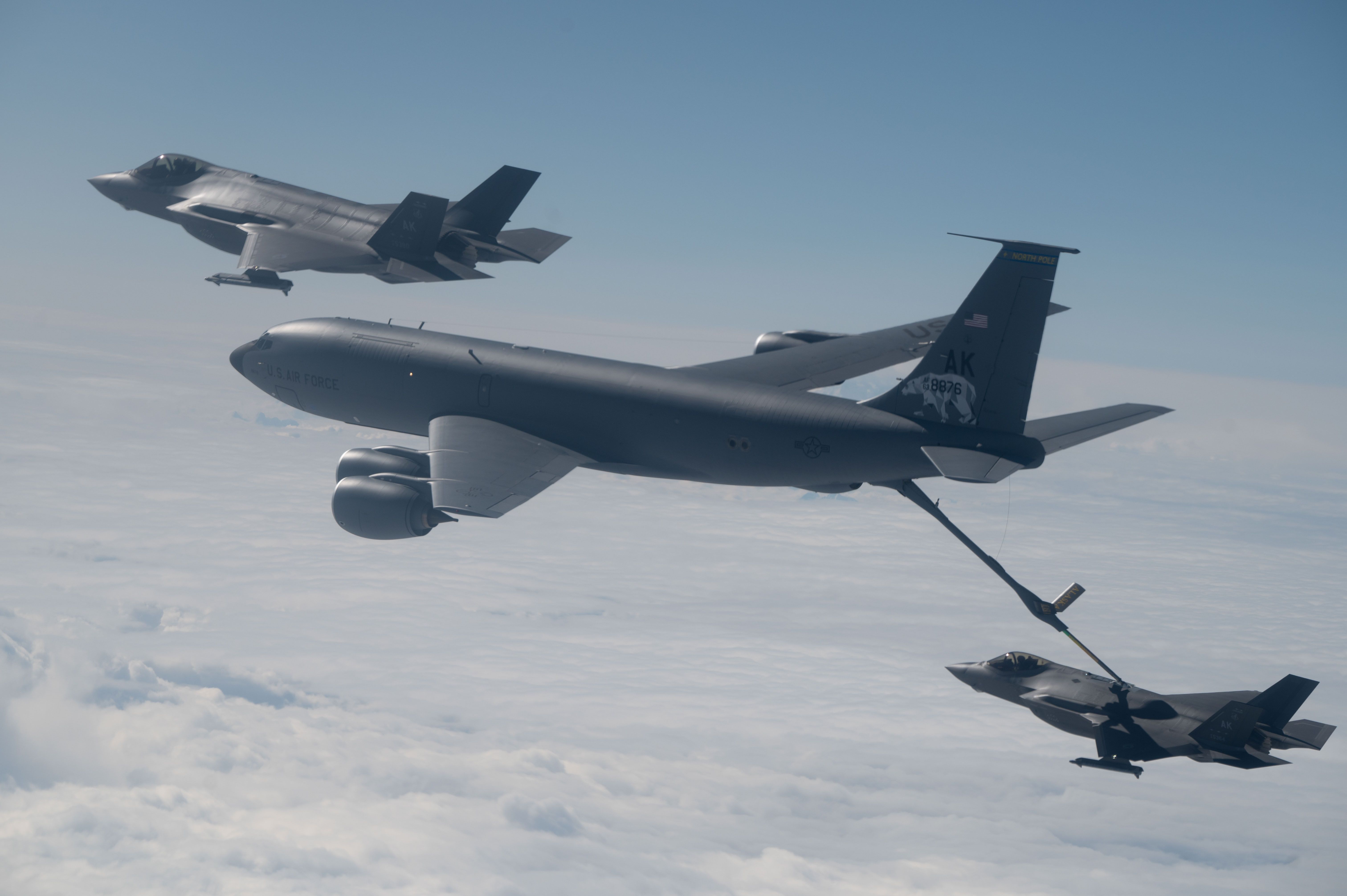 Two F-35A Lightning IIs from Eielson Air Force Base, Alaska, refuel from an Alaska Air National Guard KC-135 Stratotanker 