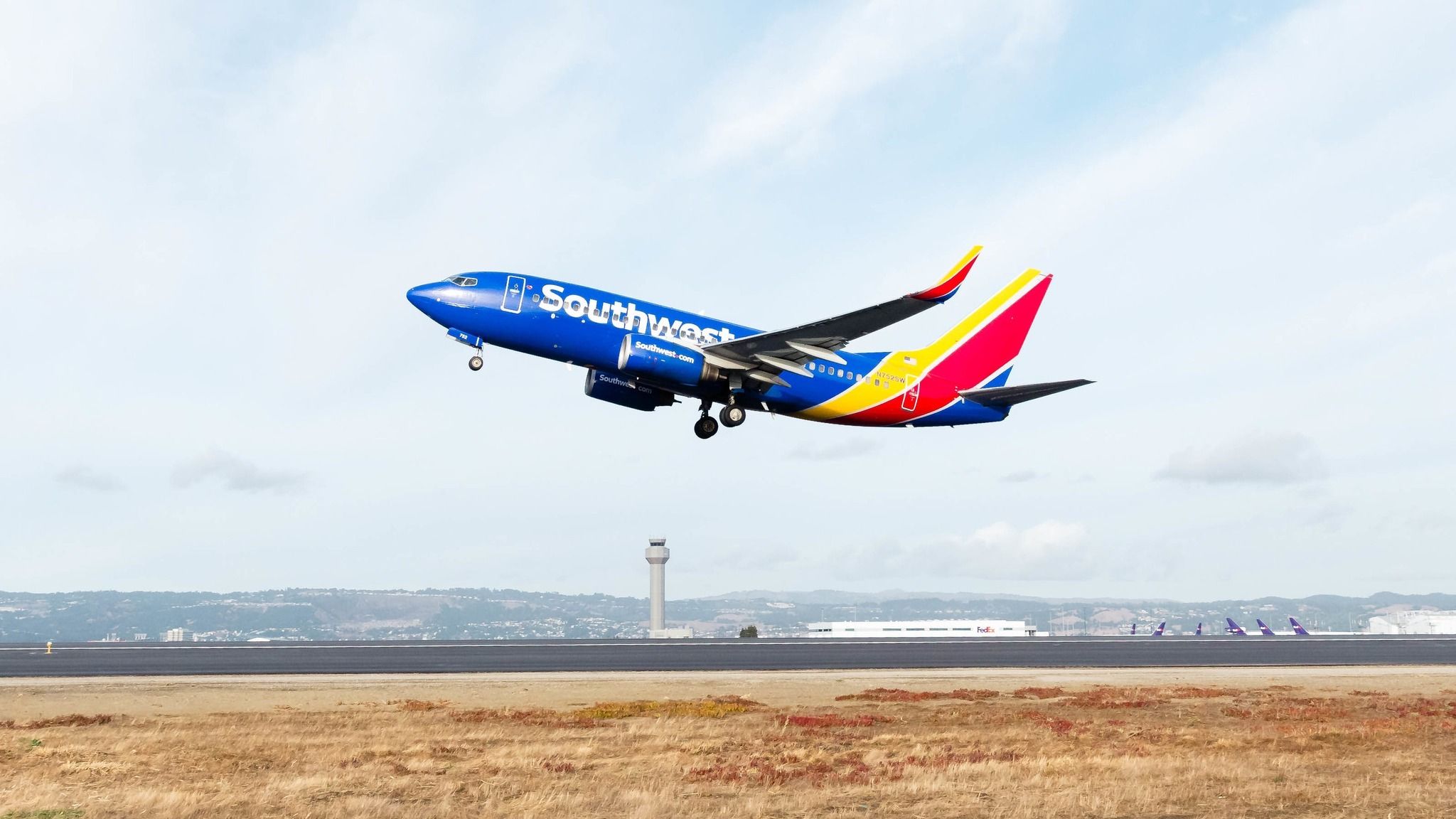 Southwest Airlines Boeing 737-7H4 taking off from Metropolitan Oakland International Airport.