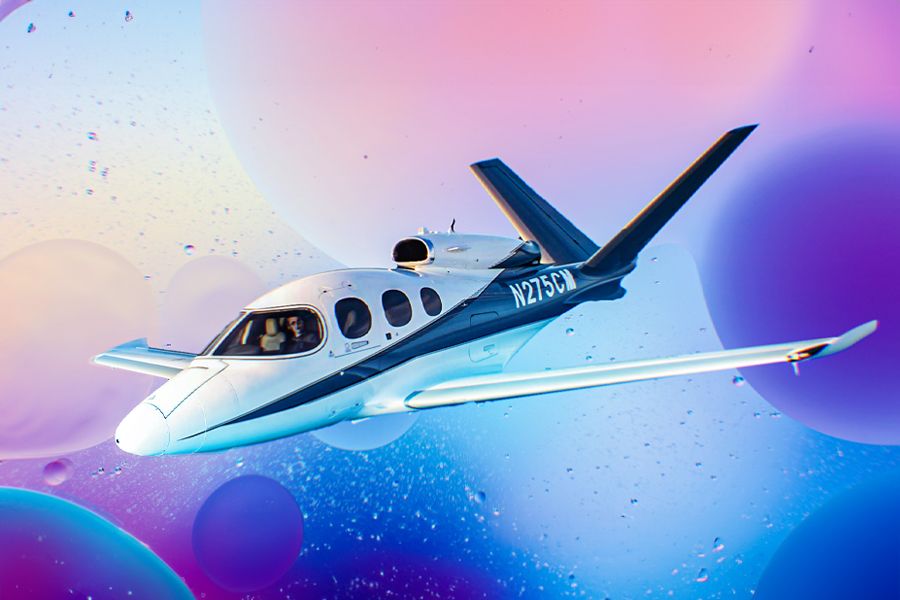A Cirrus Vision Jet with a colorful background.