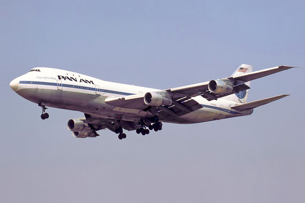A Pan Am Boeing 747-121 flying in the sky.