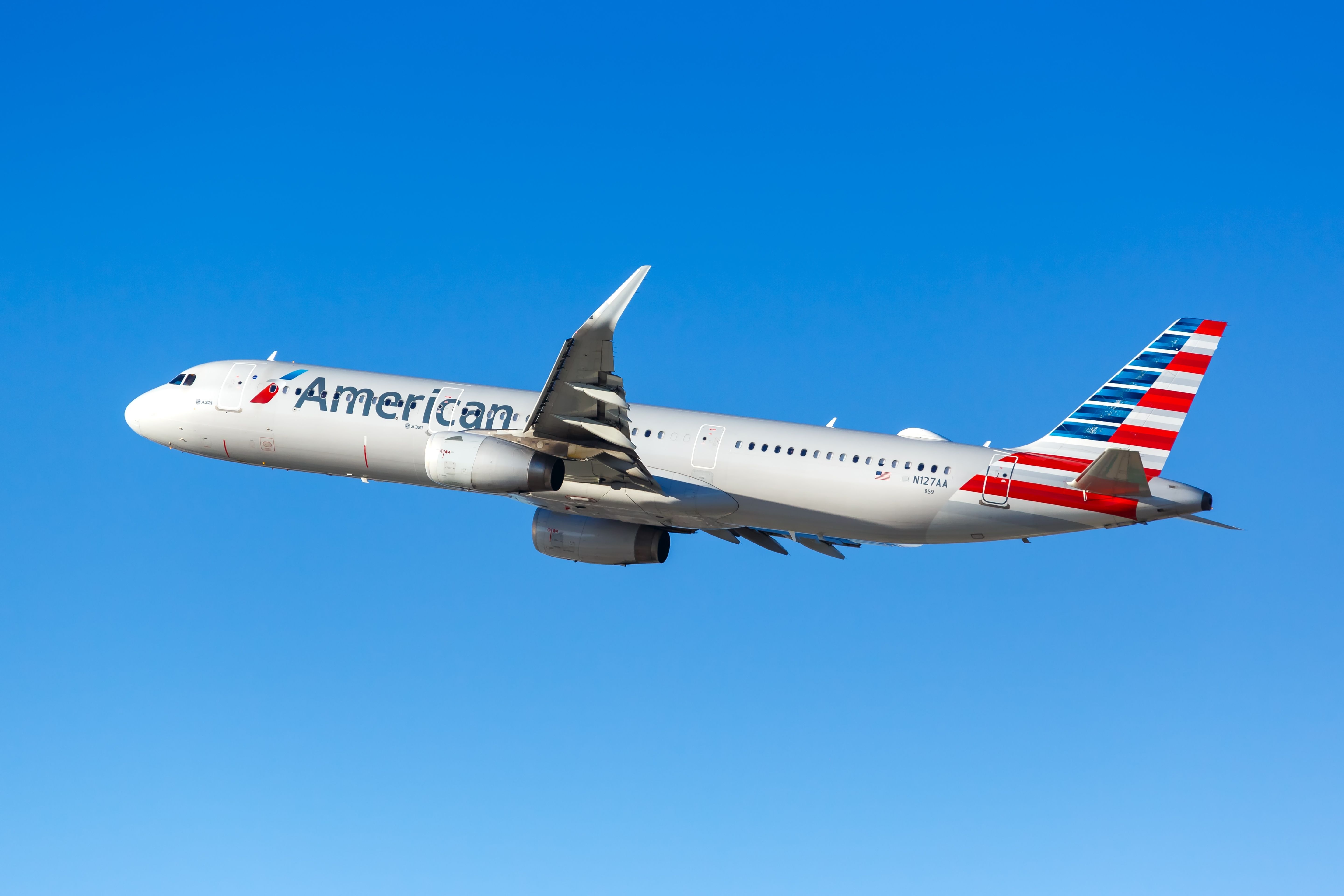 An American Airlines Airbus A321ceo flying in the sky.