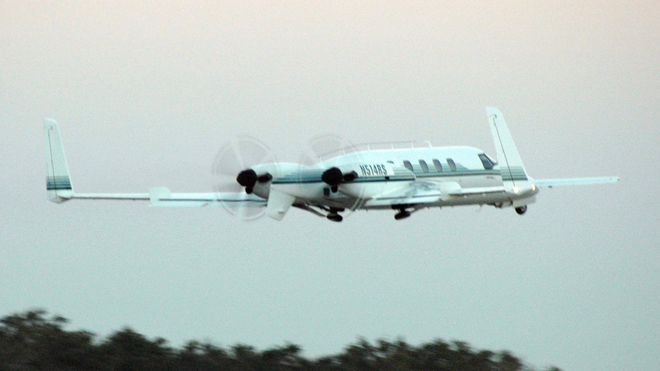 A Beechcraft Starship flying in the sky.