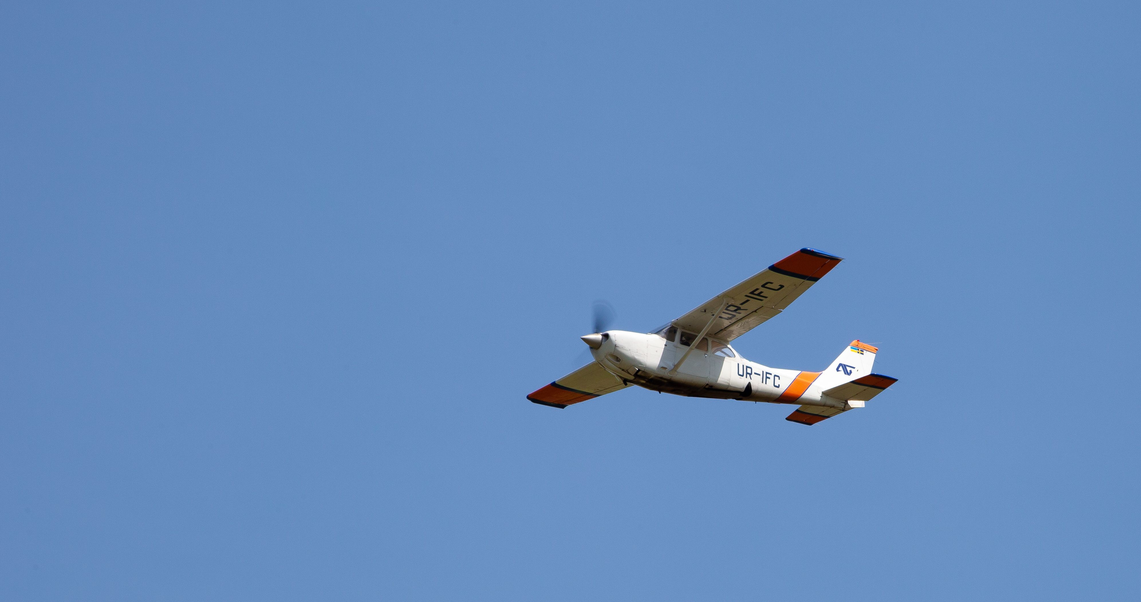 A Cessna 172 Cutlass flying in the sky.