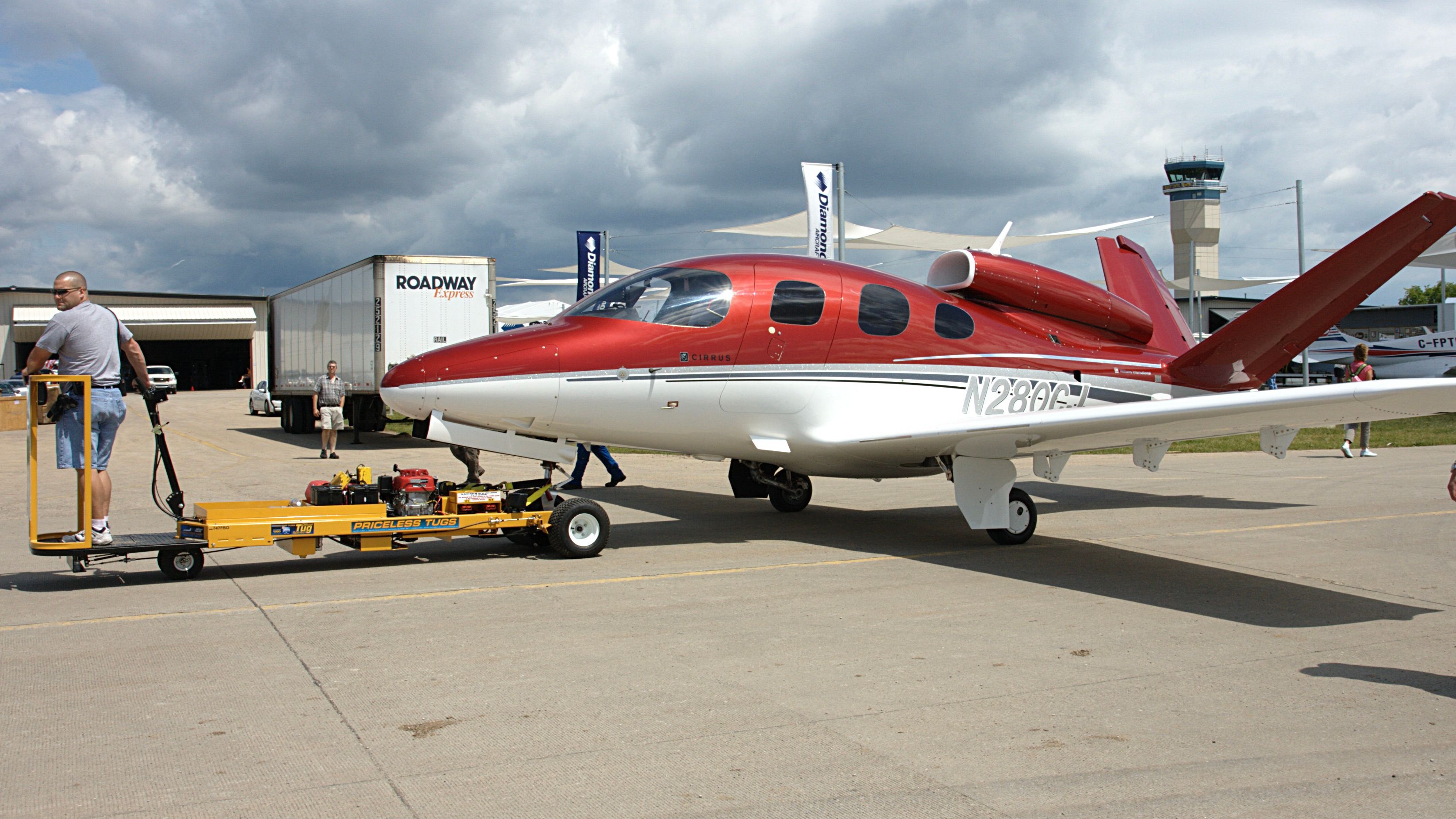 A Cirrus Vision Jet on the ground being towed.