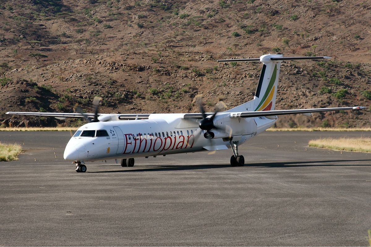An Ethiopian Airlines Dash 8 on an airport apron.