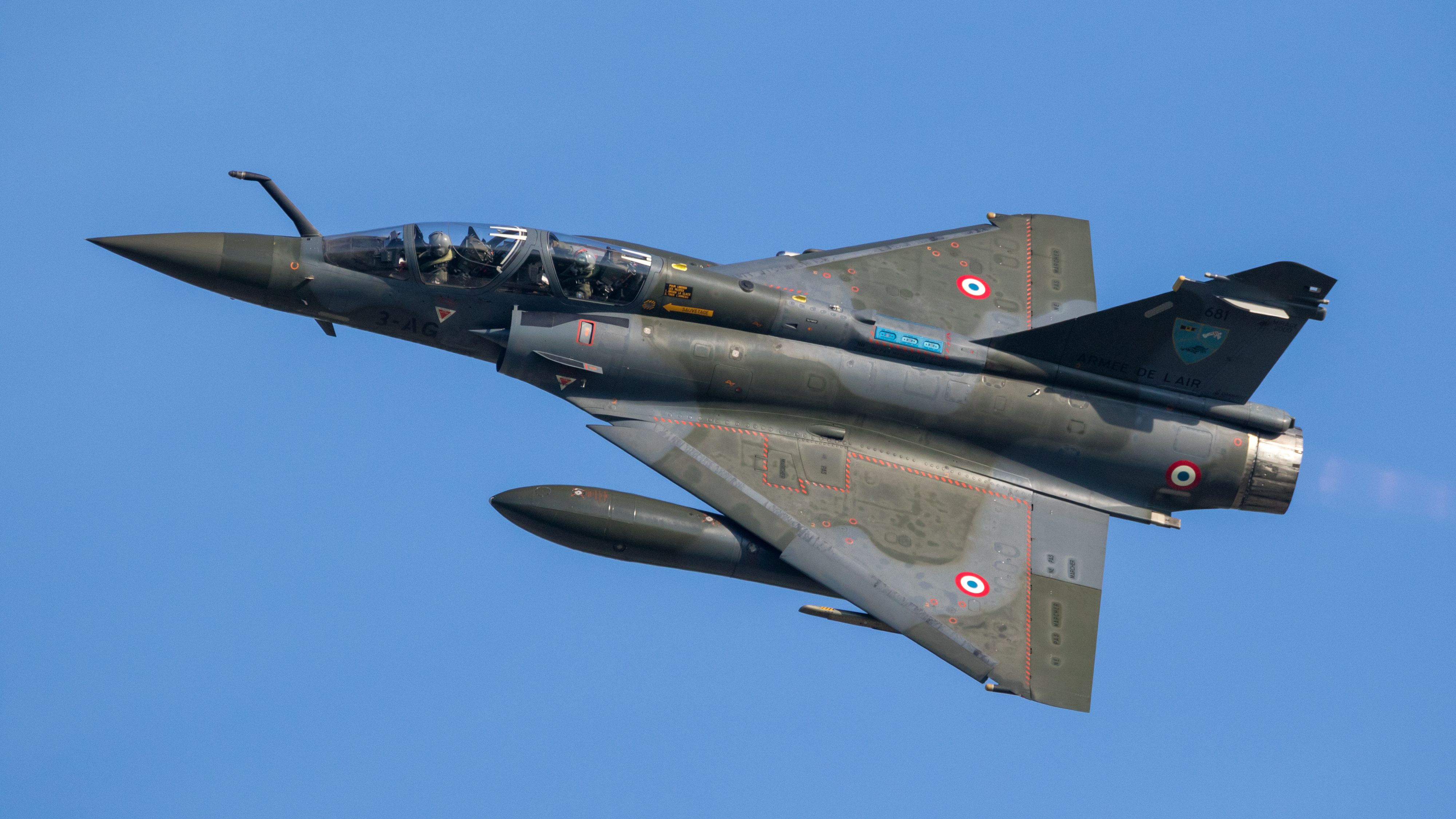 A French Air Force Dassault Mirage 2000 flying in the sky.