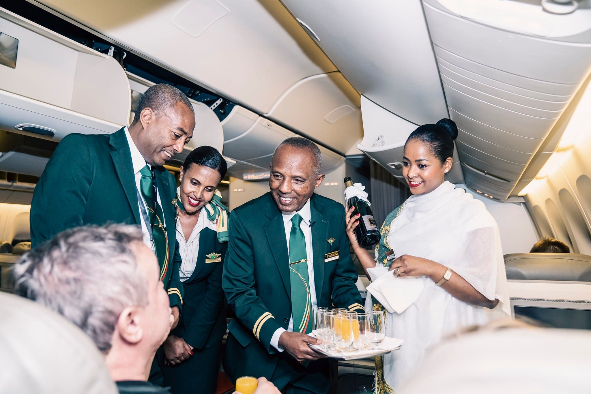 Ethiopian Airlines CEO and CCO serving a passenger on a flight