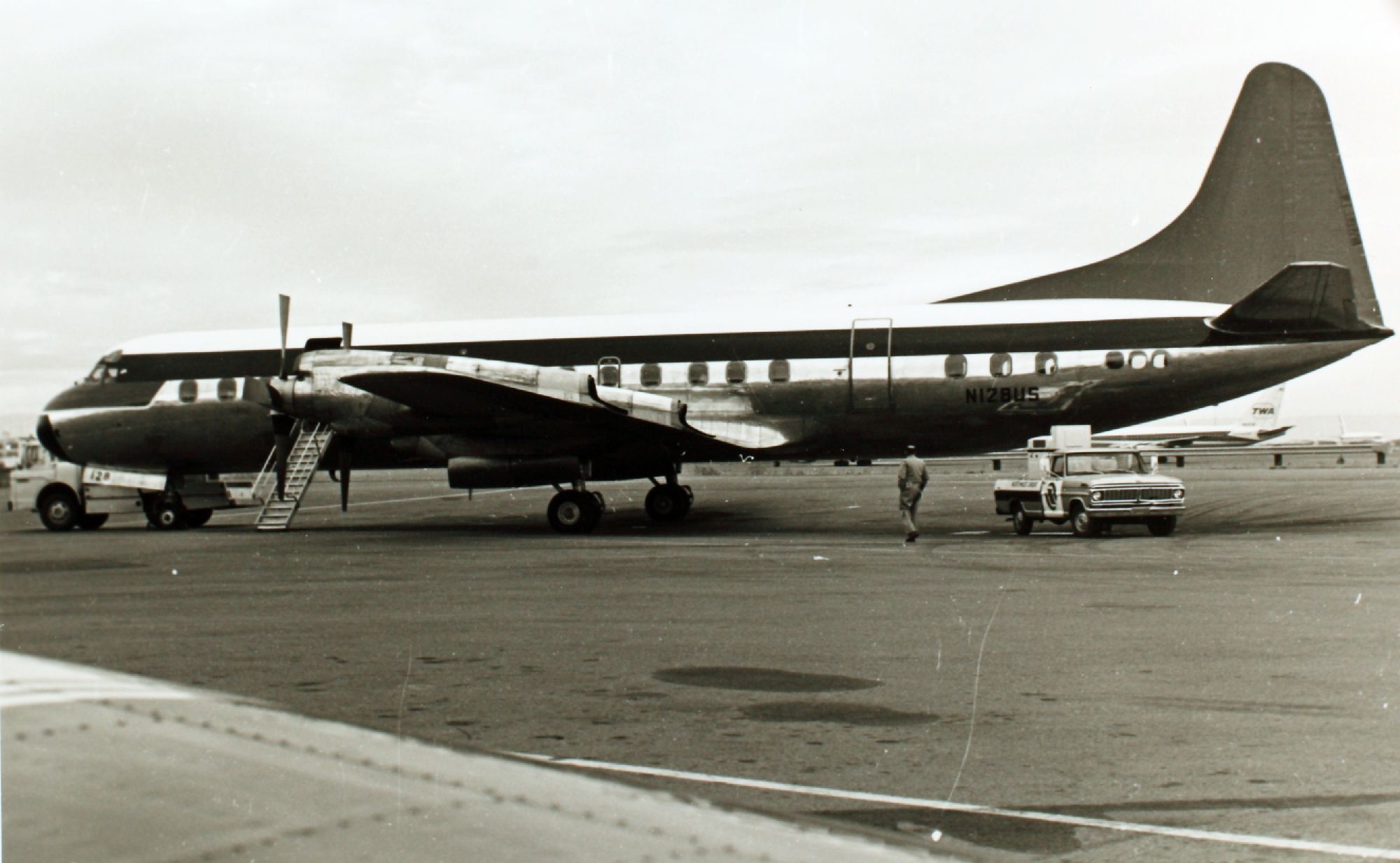 A Northwest Orient Airlines Lockheed Electra on an airport apron.