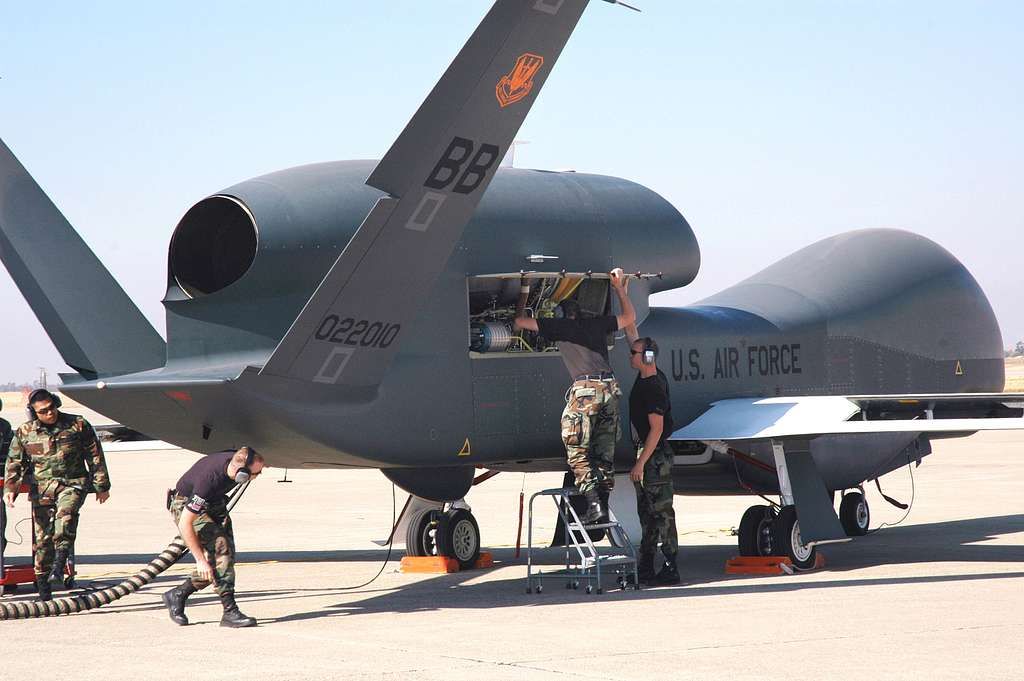 US Air Force personell inspecting an RQ-4 Global Hawk.