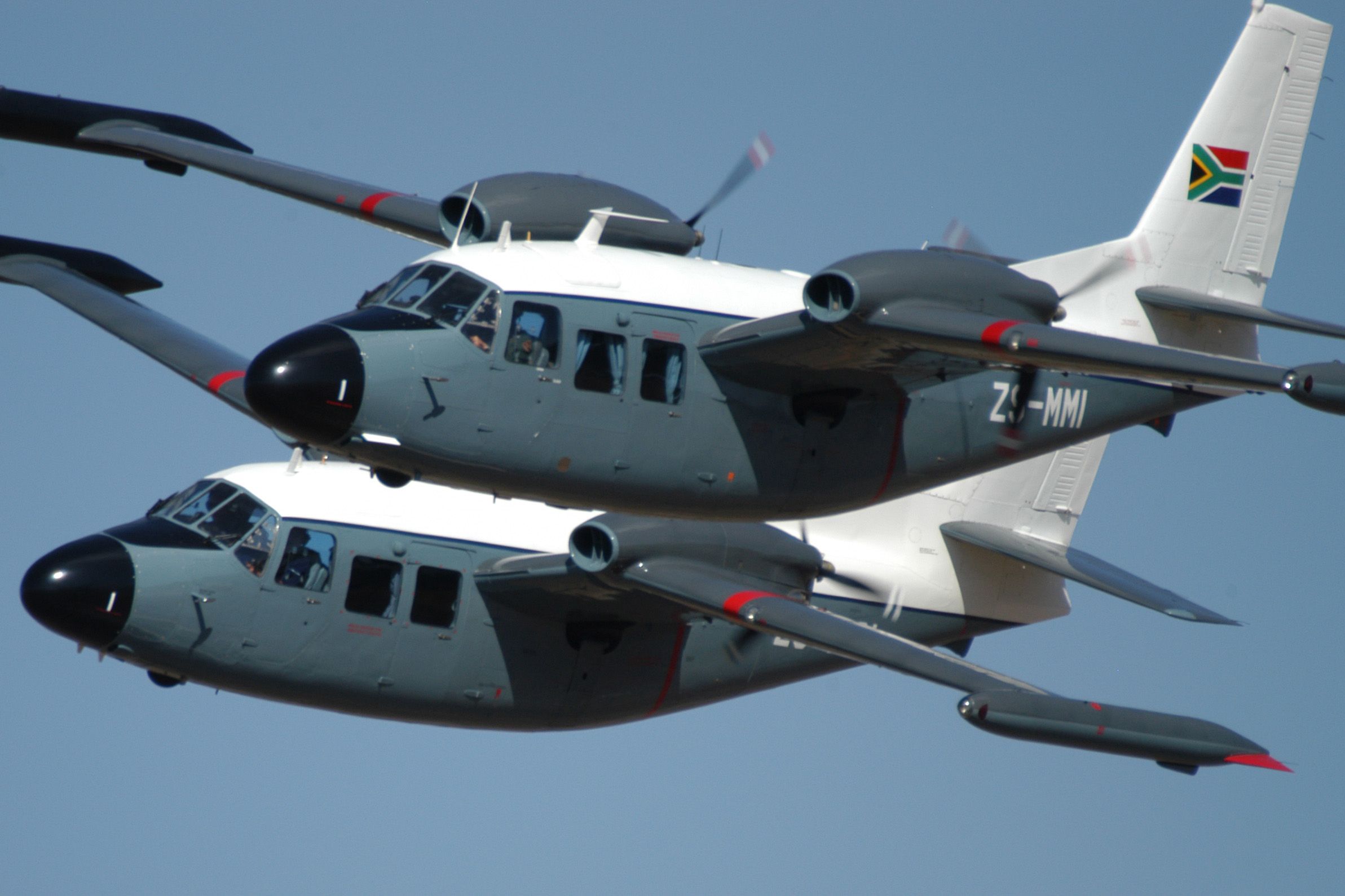 Two Piaggio P.166 Portofinos Flying in formation.