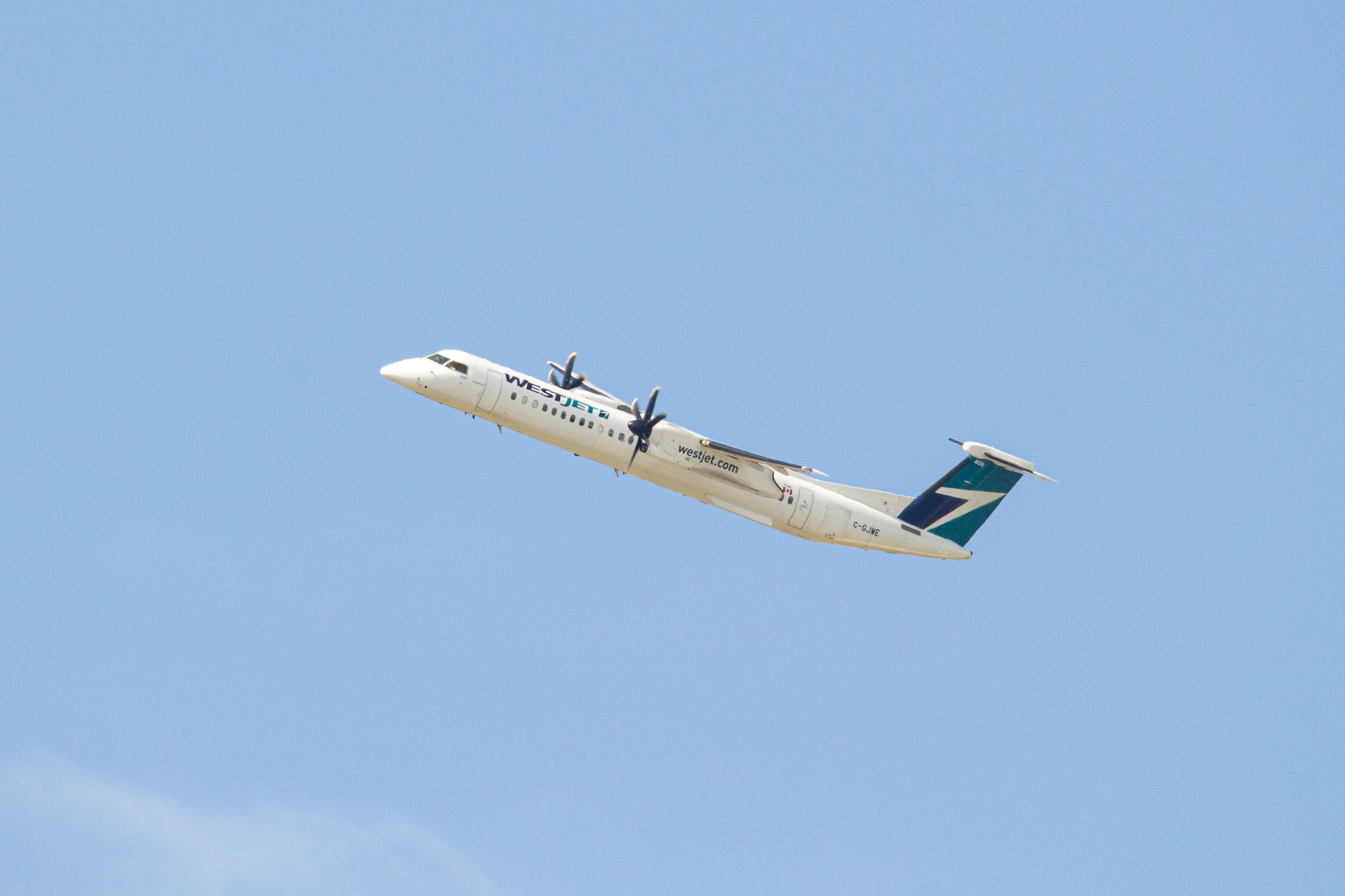WestJet Encore C-GJWE Bombardier Q400 (Dash-8) heading out to Yellowknife Airport from Calgary International Airportshutterstock_1431445556